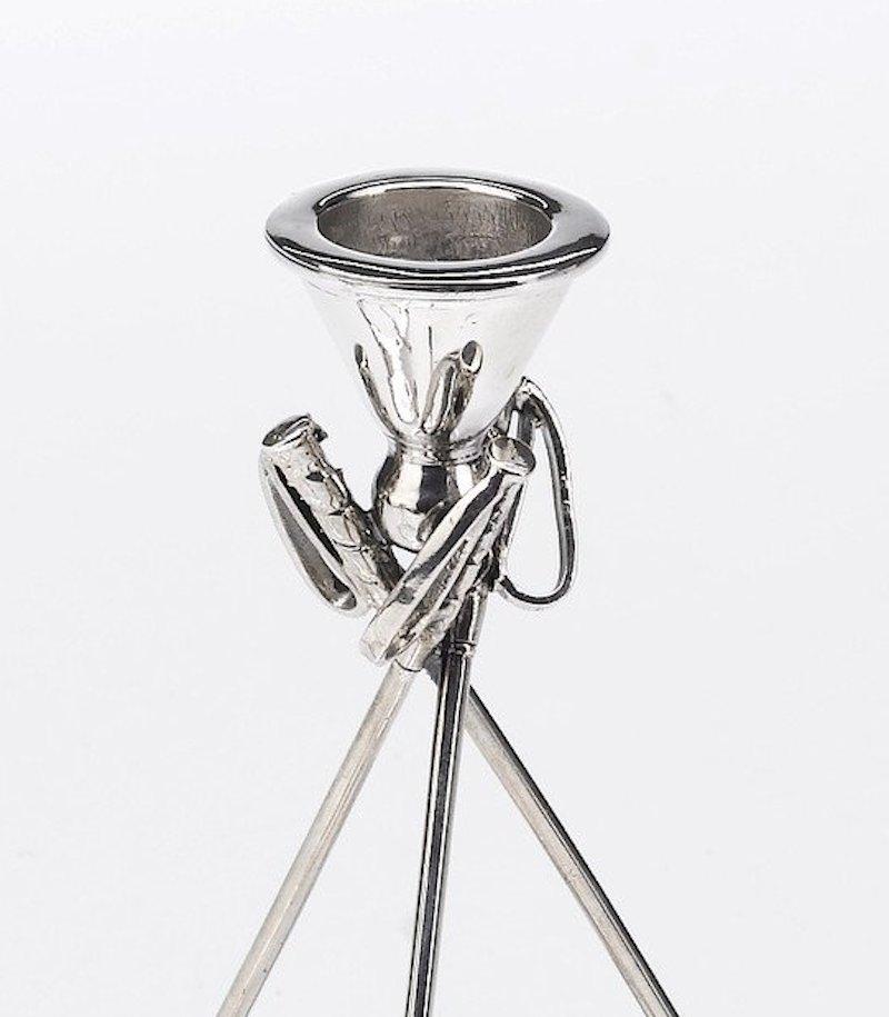 This is a beautiful set of sterling silver candleholders. Designed with a polo theme, this set is a perfect decorative item for any polo player or horse enthusiast. Each candleholder shaft is comprised of three interlocking polo mallets, resting on