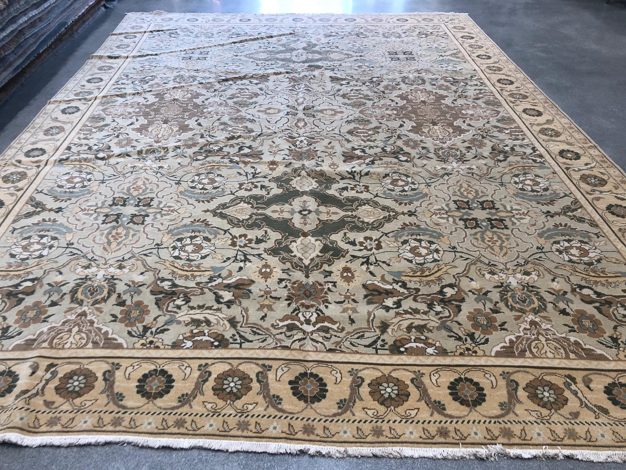 Nature comes inside as green, yellow, rust and sliver tones swirl across a beige canvas in this elegant Polonaise style floral rug. Hand knotted wool.