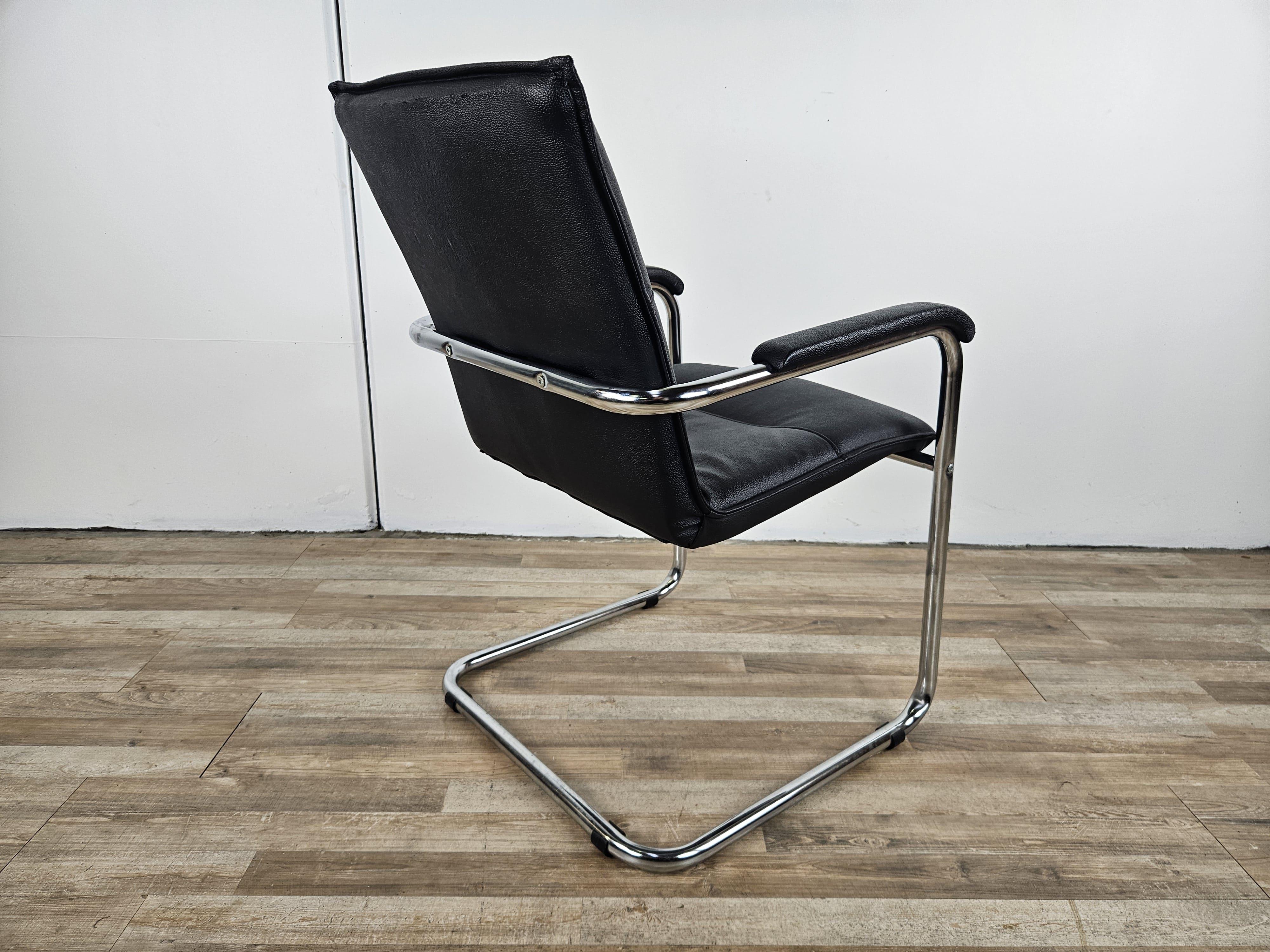 Late 20th Century 1970s armchair made of tubular steel and black faux leather For Sale