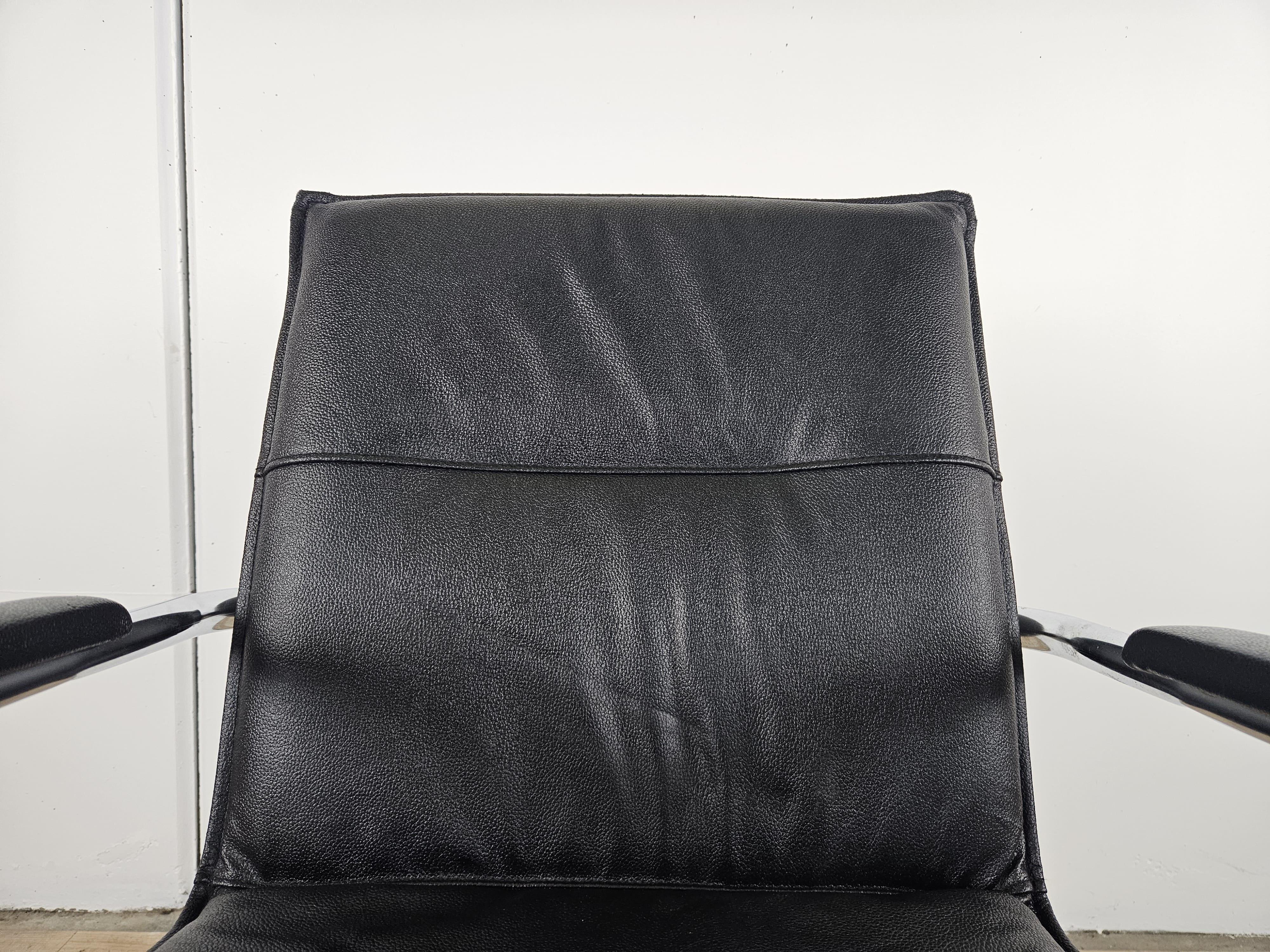 Steel 1970s armchair made of tubular steel and black faux leather For Sale