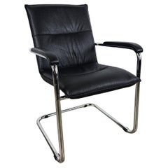 1970s armchair made of tubular steel and black faux leather