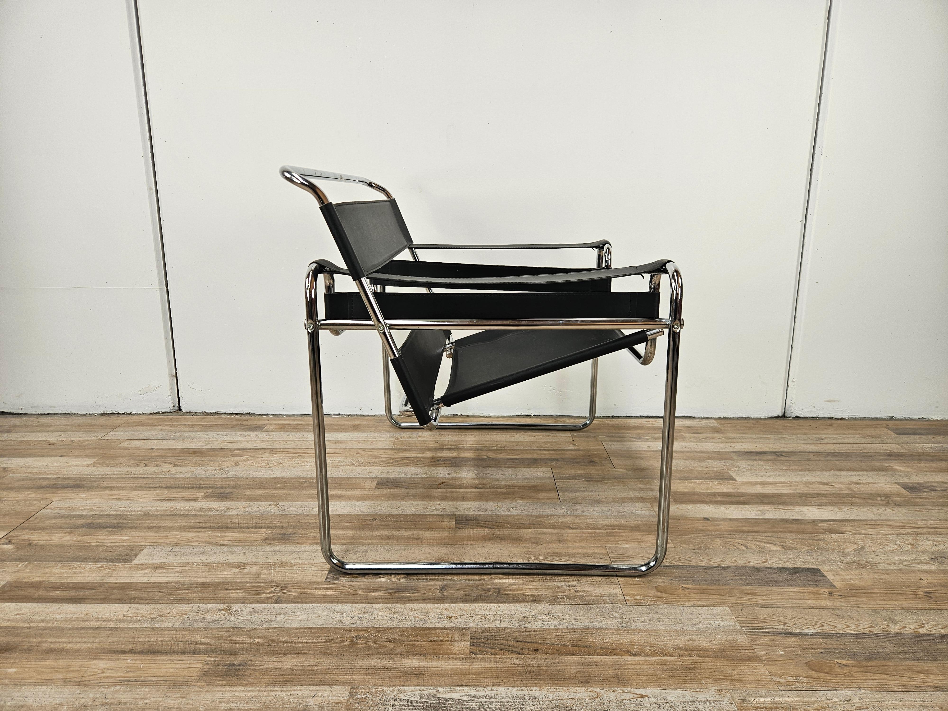 Vintage 1970s armchair with chromed tubular frame and black leather.

Seat height 39cm at head.

Normal signs due to age and use.