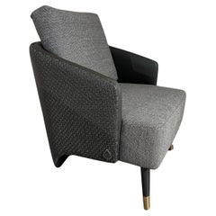 Fauteuil Brigitte en cuir tressé avec assise et dossier en tissu