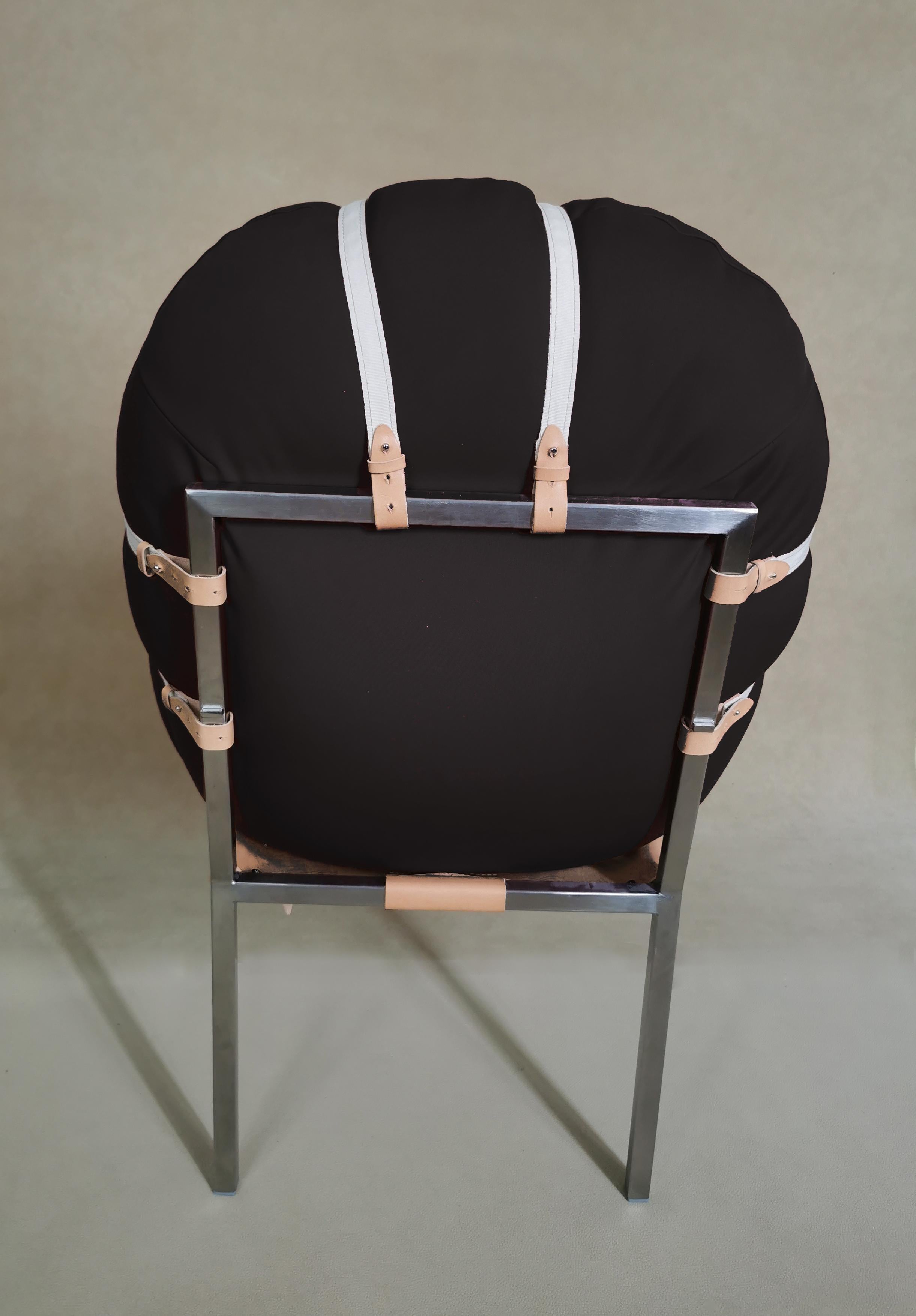Its soft, almost carnal cushion changes shape, adapting to the weight of the body that occupies it, accommodating it, adjusting to its size and swelling around the ropes that hold it. Despite the efforts of the ropes to confine it, the chair body