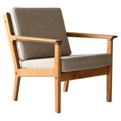 Hans Wegner GE265 vintage Danish armchair with fixed backrest