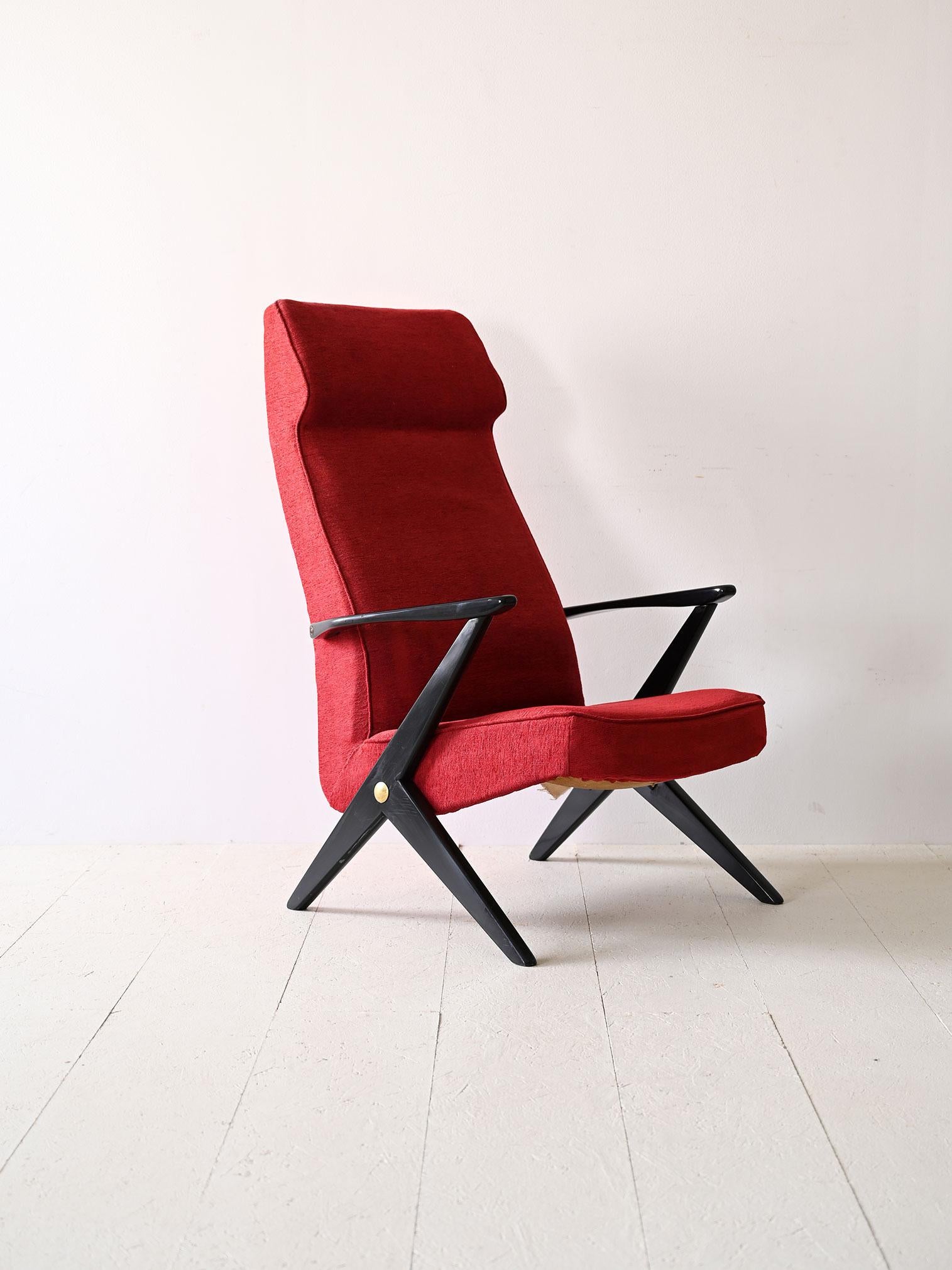 Original 1950s red Nordic armchair.

This characterful armchair is wrapped in a vibrant shade of red. The black-colored wooden frame emphasizes the contrast and gives the armchair a sophisticated look.

The designer of this chair is Bengt Ruda who