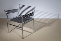 Renè Herbst armchair, steel and elastic cord, 1970s