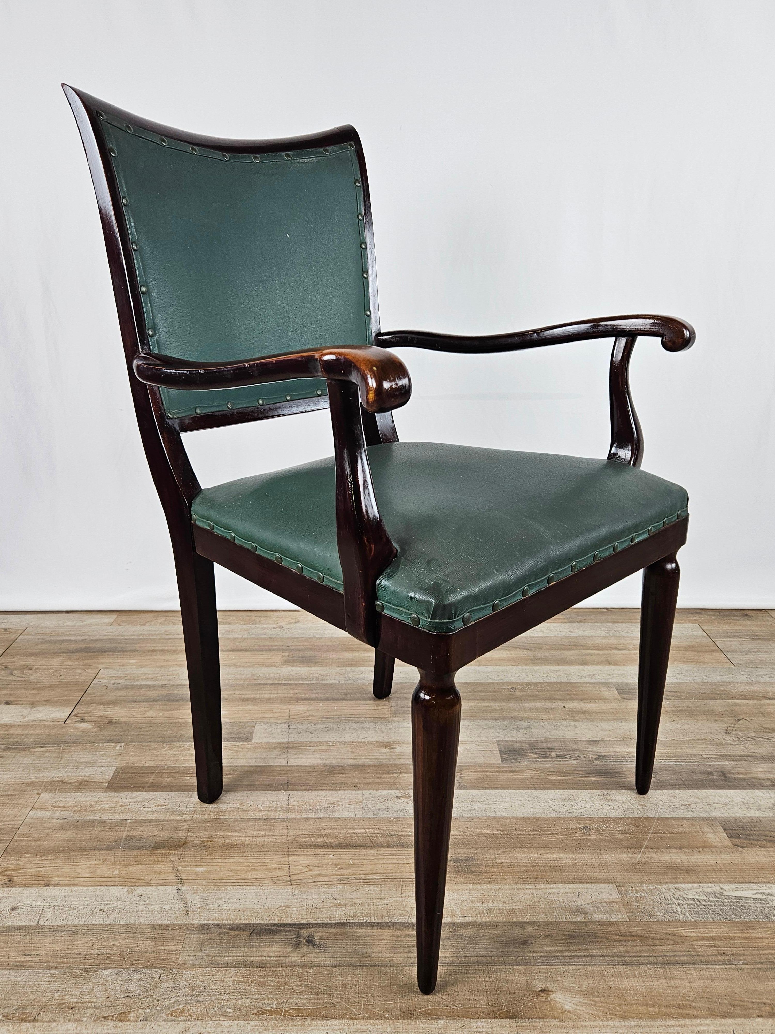 Elegant walnut study chair with upholstered back and seat in green skai decorated with perimeter studs.

Very refined chair, suitable in classy environment of all kinds from modern to antique.

The chair has been oil polished, the skai is the