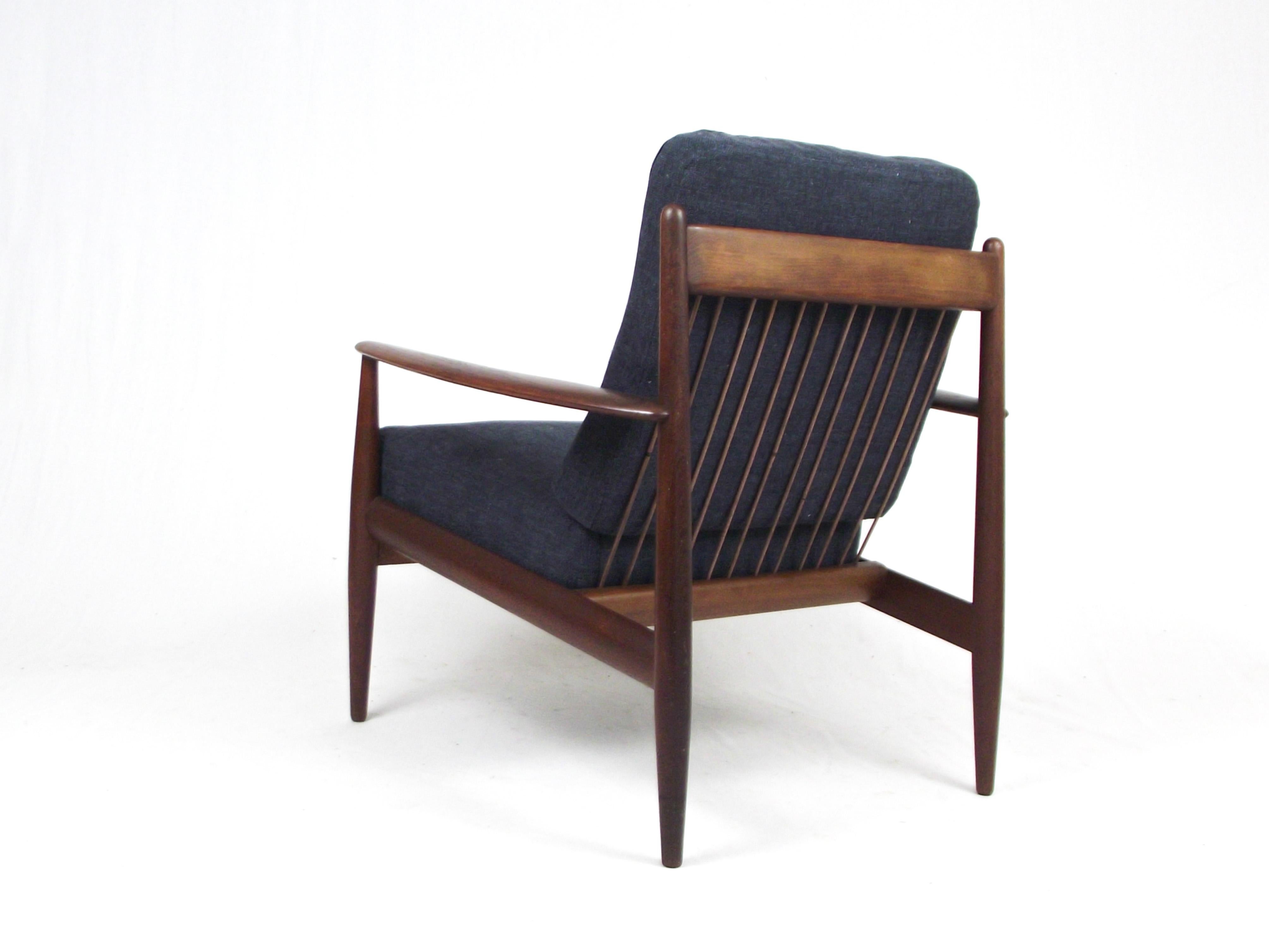 Armchair  danish 1950s designed by Grete Jalk and produced in the early 1950s by France & Daverkosen (known from the early 1960s as France & Son )

Solid teak wood frame , vinyl-covered springs, reupholstered. 

The chair features the manufacturer's