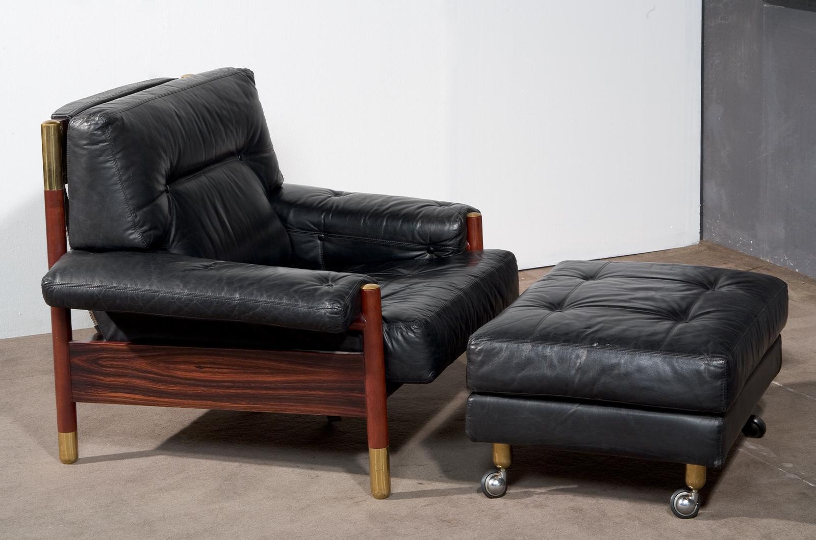 Armchair and ottoman designed by Carlo De Carli for Sormani, circa 1970s. The armchair features a large polished wooden frame to accommodate generous leather-covered cushions. The armchair is completed with the matching ottoman, in the same