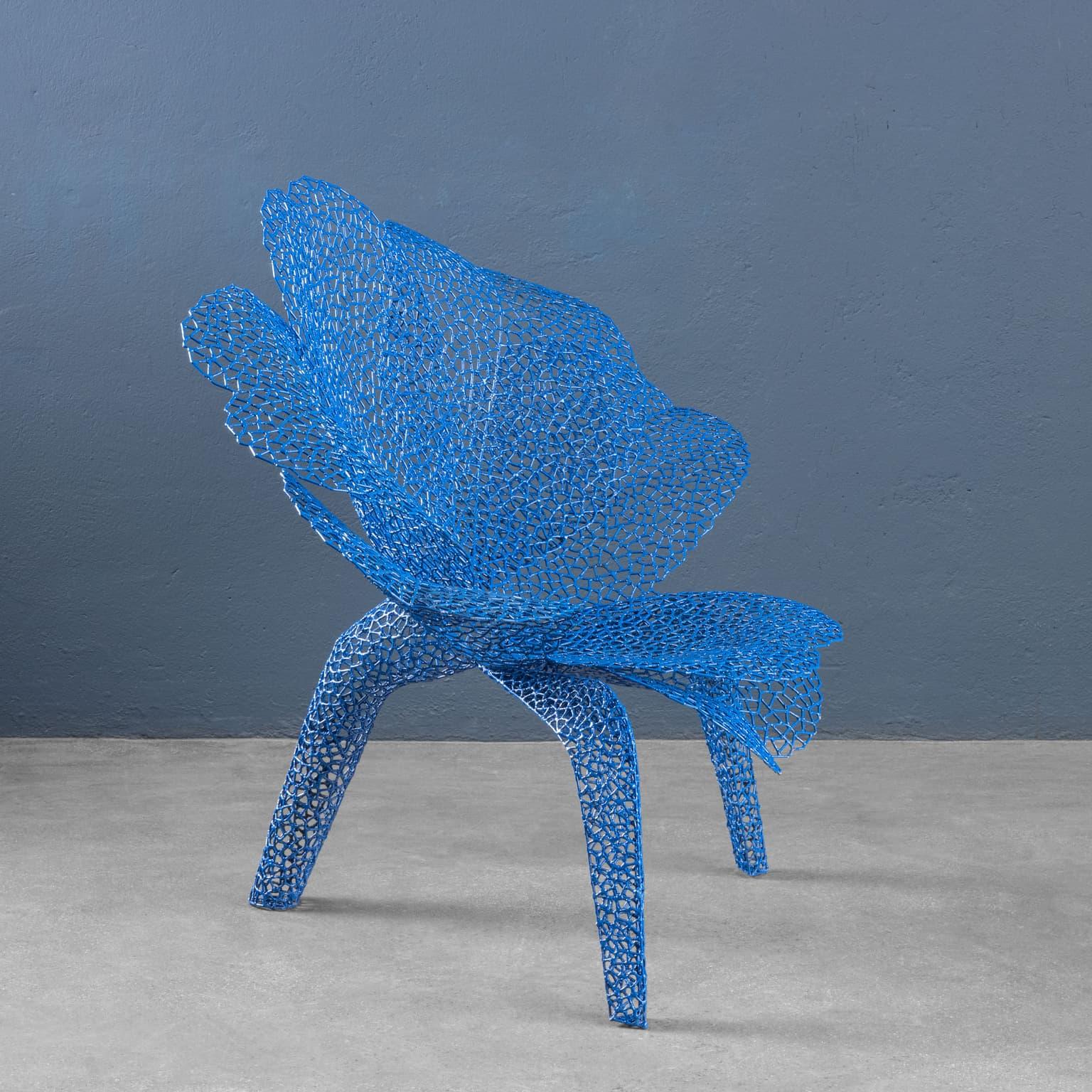 An armchair designed and made by Anacleto Spazzapan by welding small iron parts made from a rod and then enameled blue, which recalls the shape of a flower with round petals, whose name it bears. Seat bearing the artist's initials and belonging to