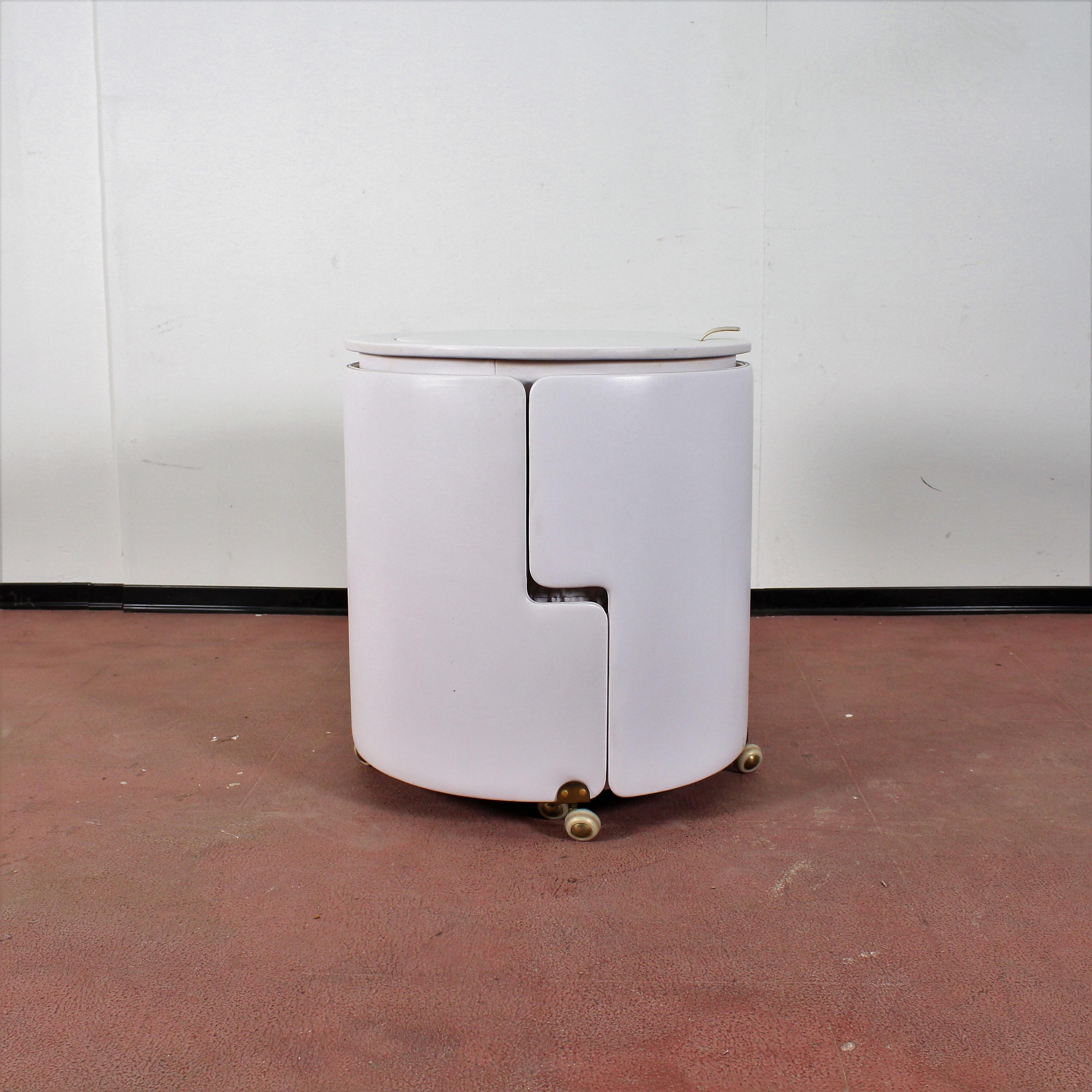 Luigi Massoni, Vanity table Dilly-Dally for Poltrona Frau. Designed in 1968. Two-piece, rollers, white leather brace, chair labeled on underside
 Normal traces of wear commensurate with age.