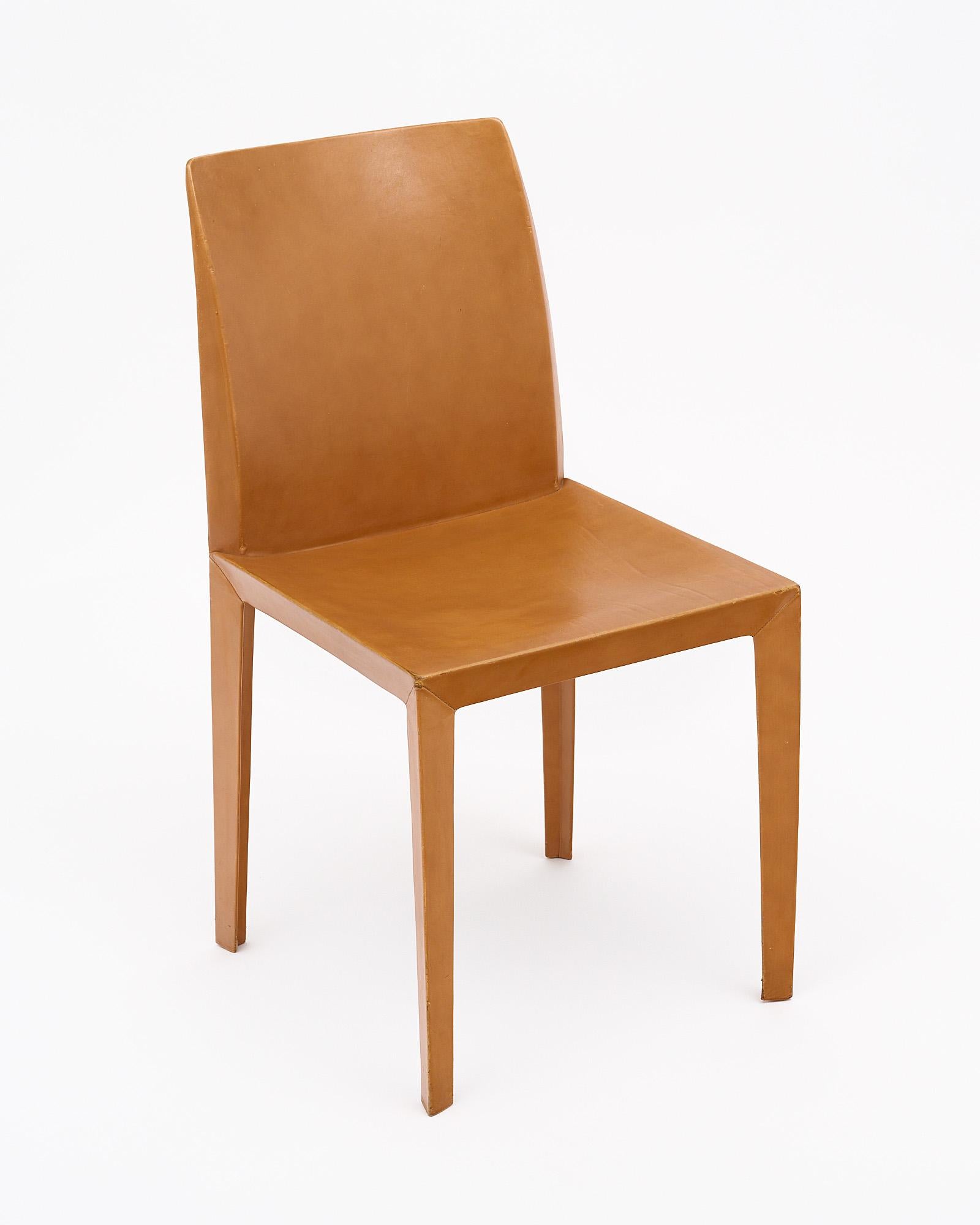 Set of four chairs in the Italian Modernist style by iconic company “Poltrona Frau”. This set is fully lined with fine tan colored leather.
