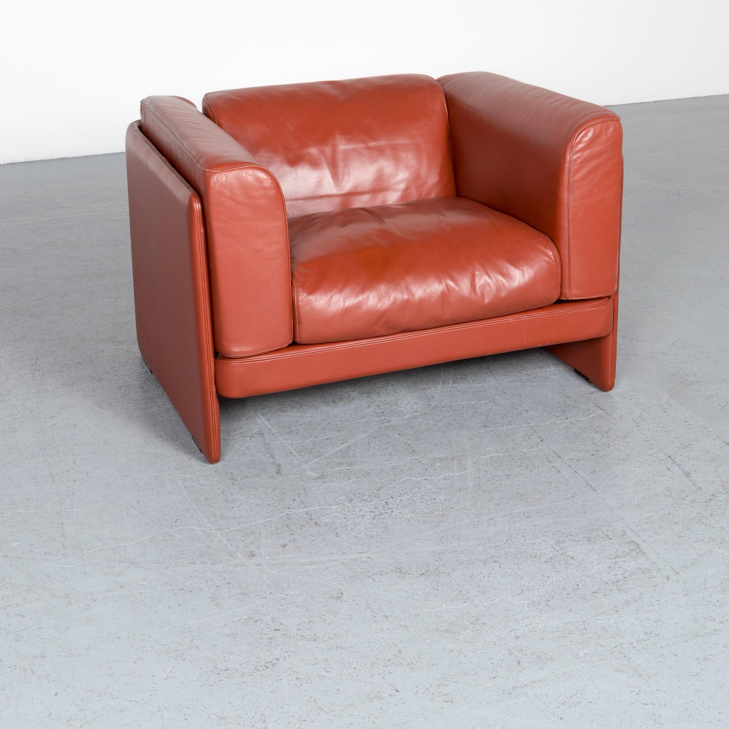 We bring to you a Poltrona Frau Le Chapanelle designer leather armchair orange by Tito Agnoli.