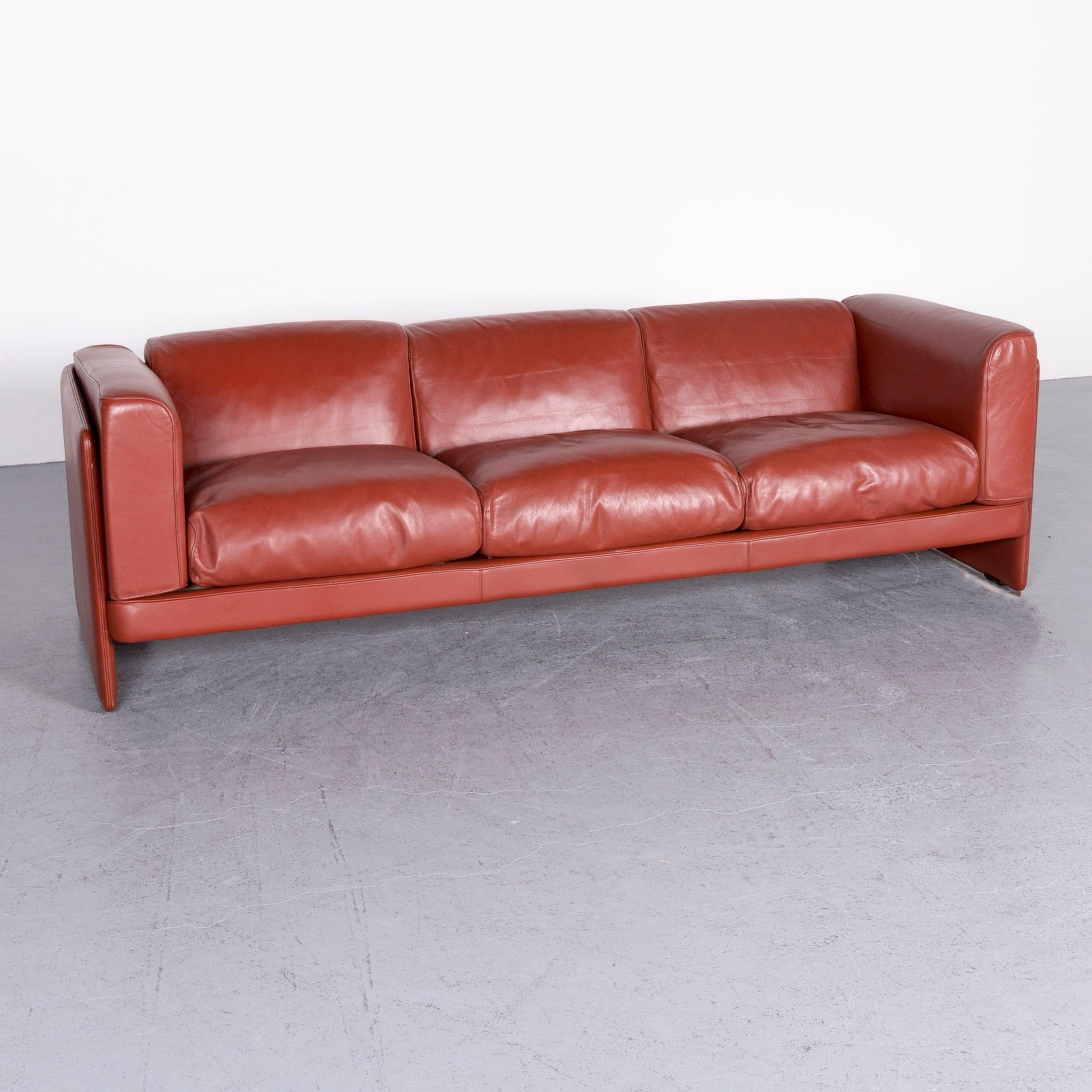 We bring to you a Poltrona Frau Le Chapanelle designer leather sofa orange by Tito Agnoli.