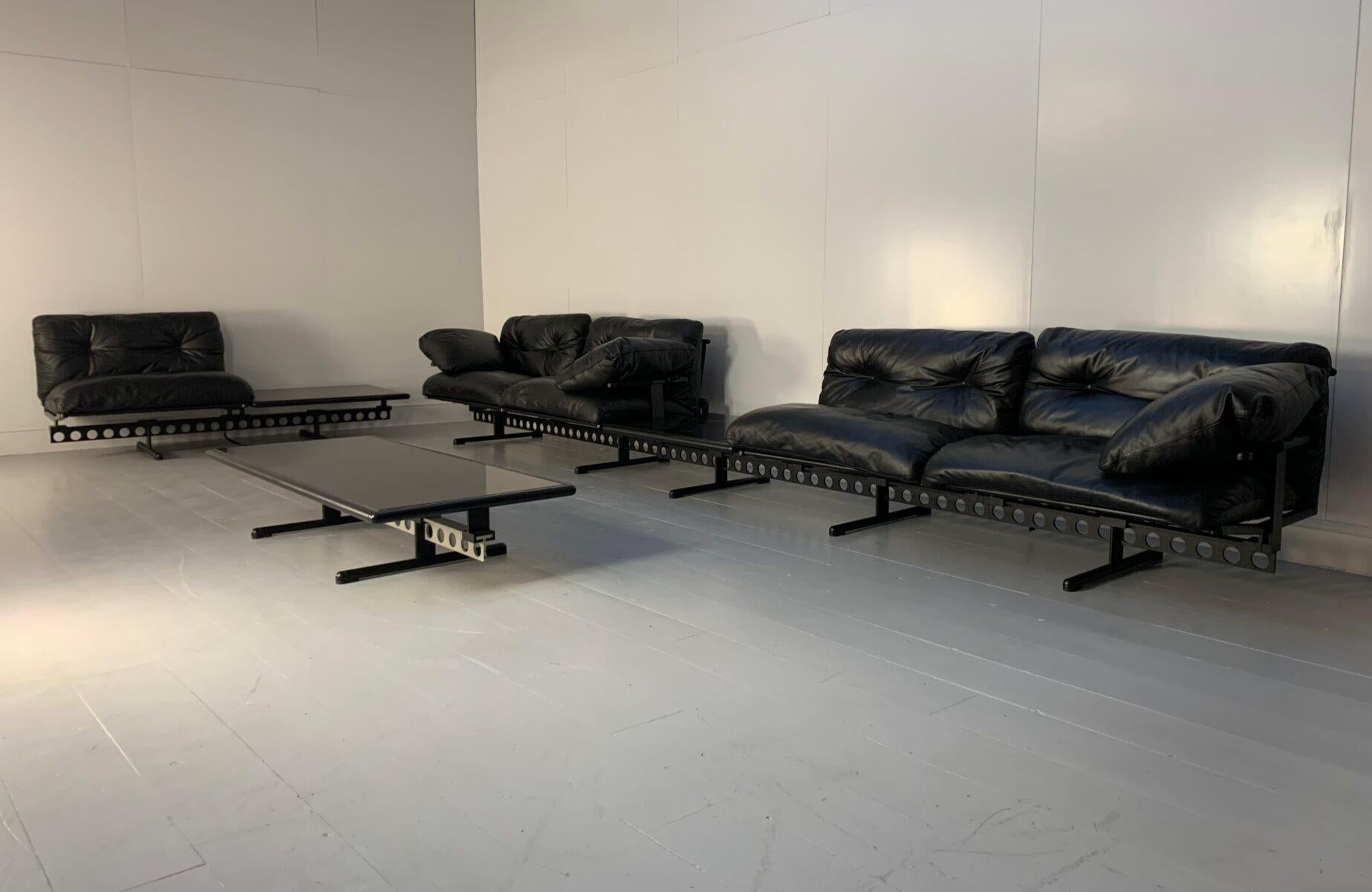 On offer on this occasion is an ultra-rare 7-Seat “Ouverture” suite of seating, consisting of a two-seat sofa with 2-arms (which, in reality, seats 3 in comfort),  a two-seat sofa with 1-arm and side-black-marble table (which also seats 3 in