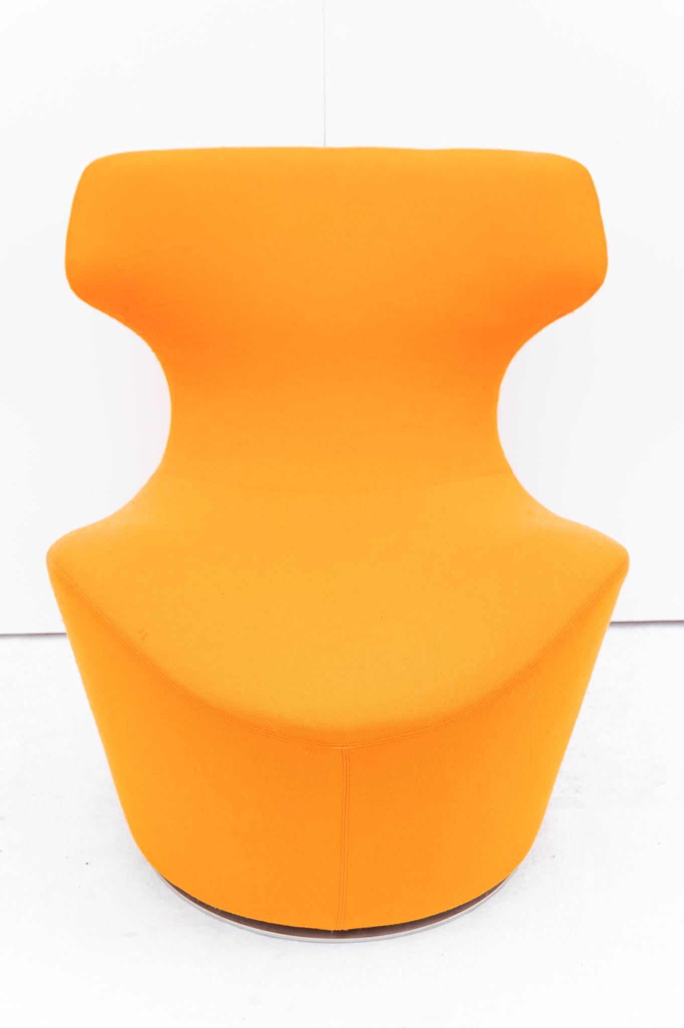 Large armchair with pouf Papilio by B&B Italia, Anni 2009. 
Upholstered swivel armchair upholstered in orange fabric, with its elegance is a unique badge to furnish the home. The attribution mark is present. The large PAPILIO armchair and POUF were