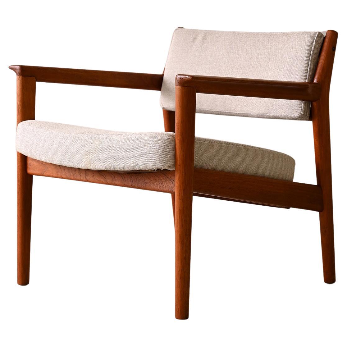 Upholstered armchair with teak frame For Sale