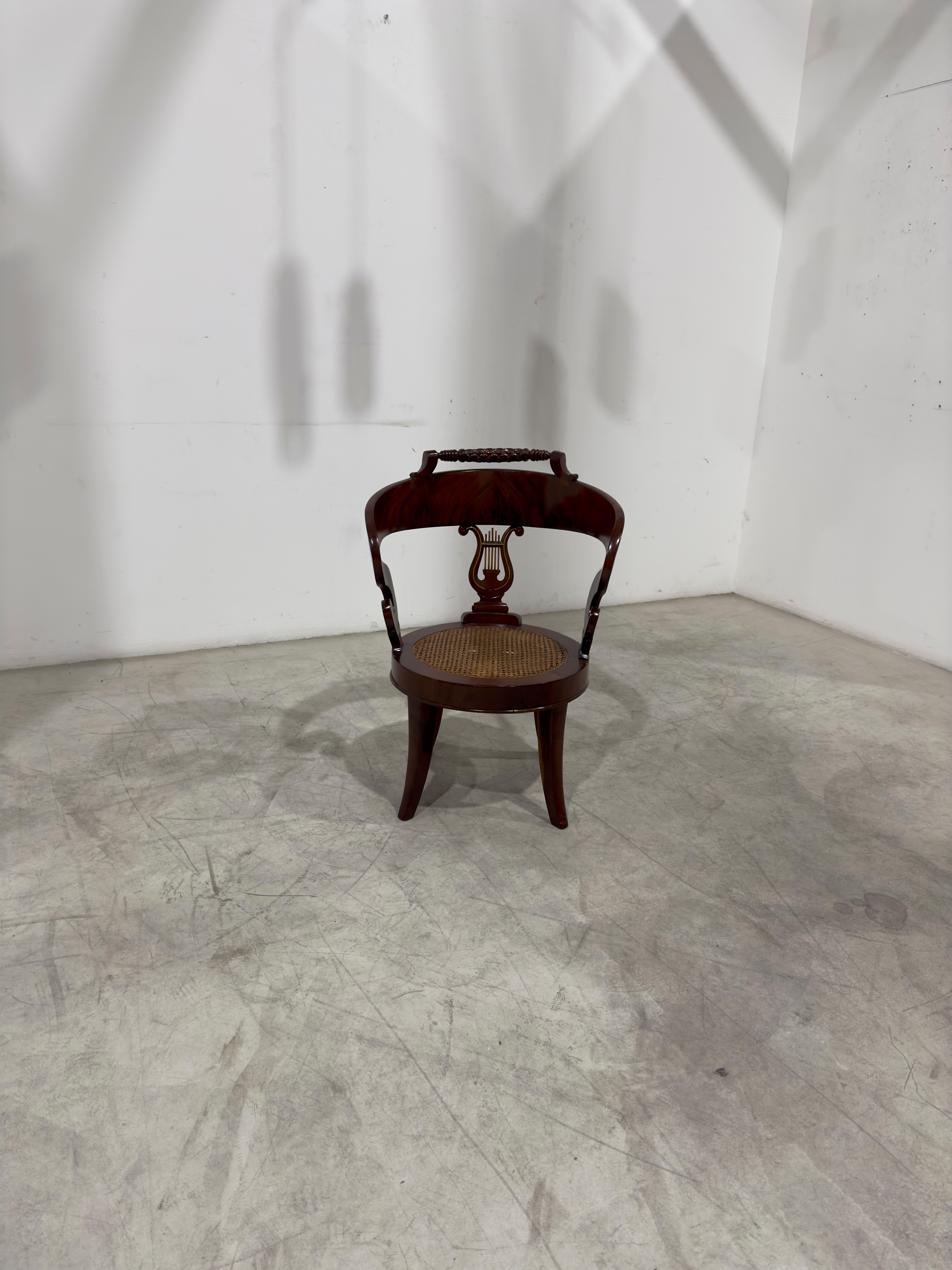 Empire armchair made of wood and Vienna straw seat. France 1810.
