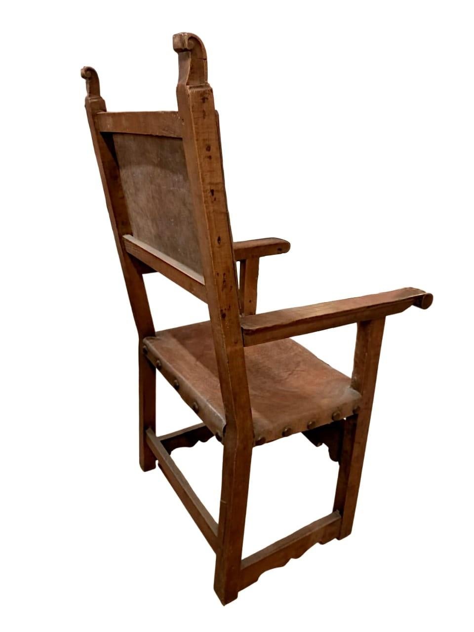 Hand-Carved Antique leather armchair with studs 17th century For Sale