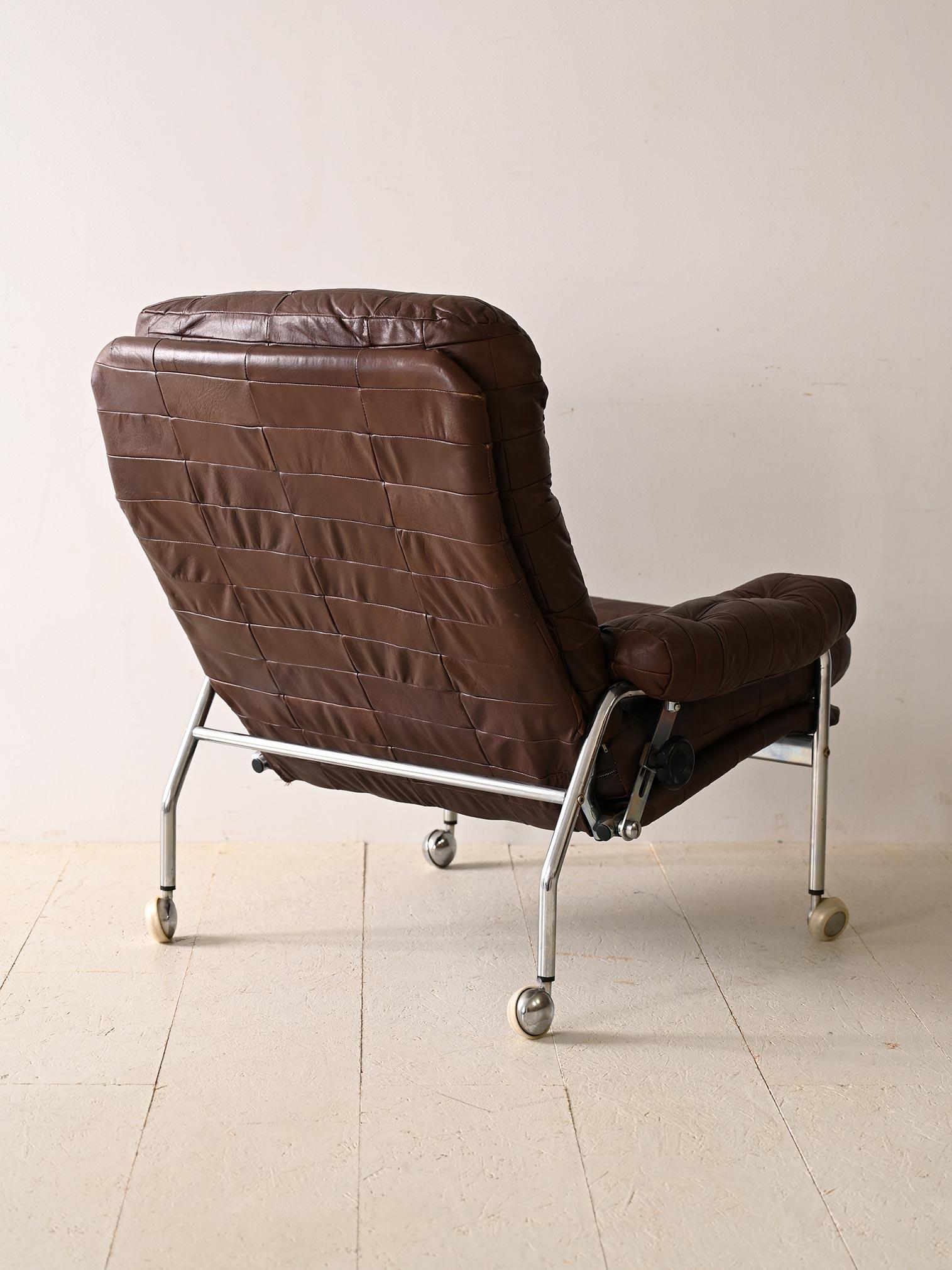 Scandinavian Leather armchair with metal legs For Sale