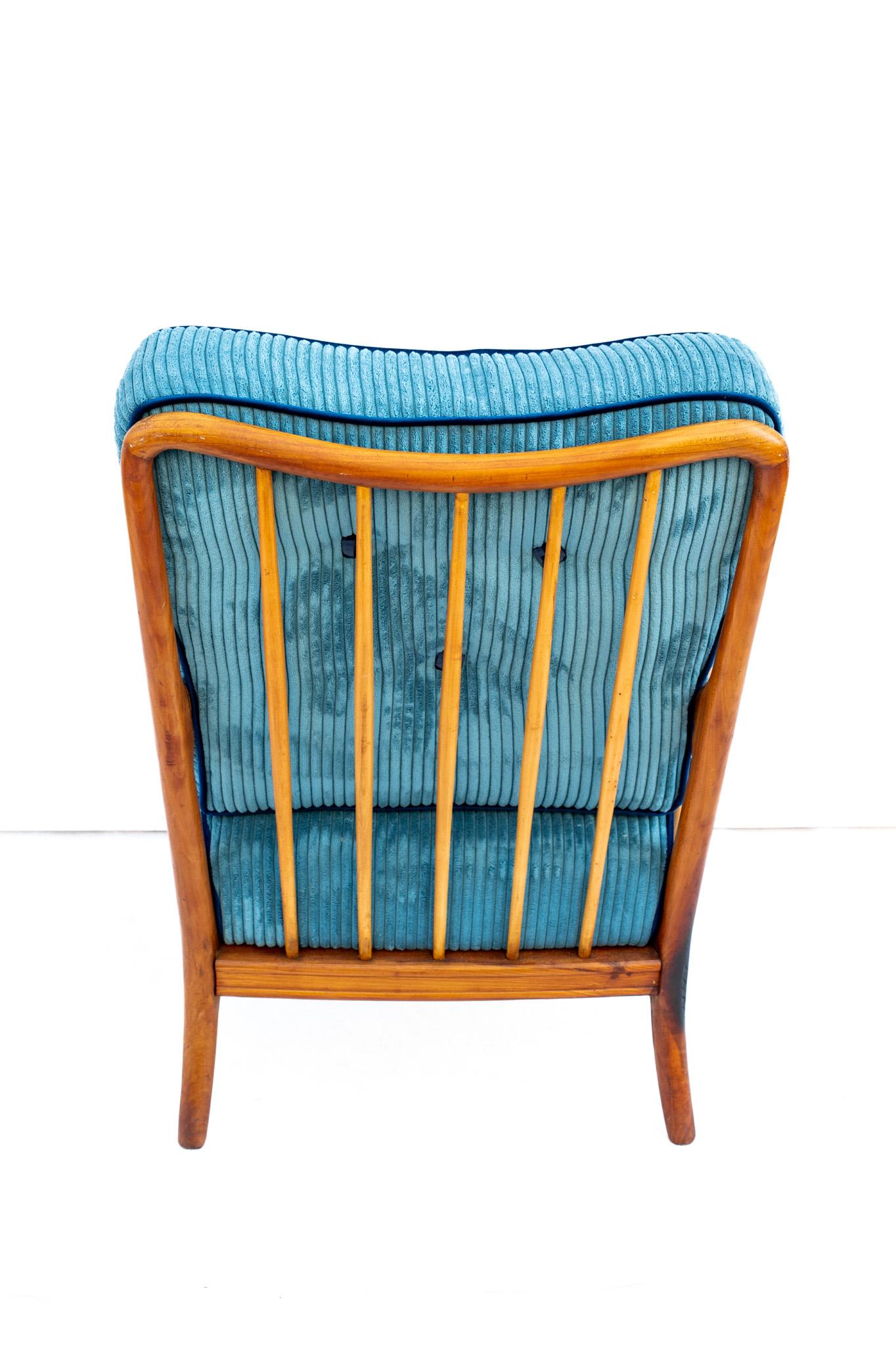 Velvet armchair by Paolo Buffa, Made in Italy, 1950s.  
One of the most iconic and important models of mid-century Italian design. The frame of this armchair is made of wood, the cushions upholstered in light blue corduroy with blue piping. The