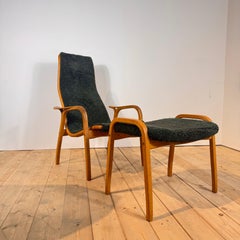 Lamino Armchair by Yngve Ekström, made of wood and green fabric, Sweden, 1960s