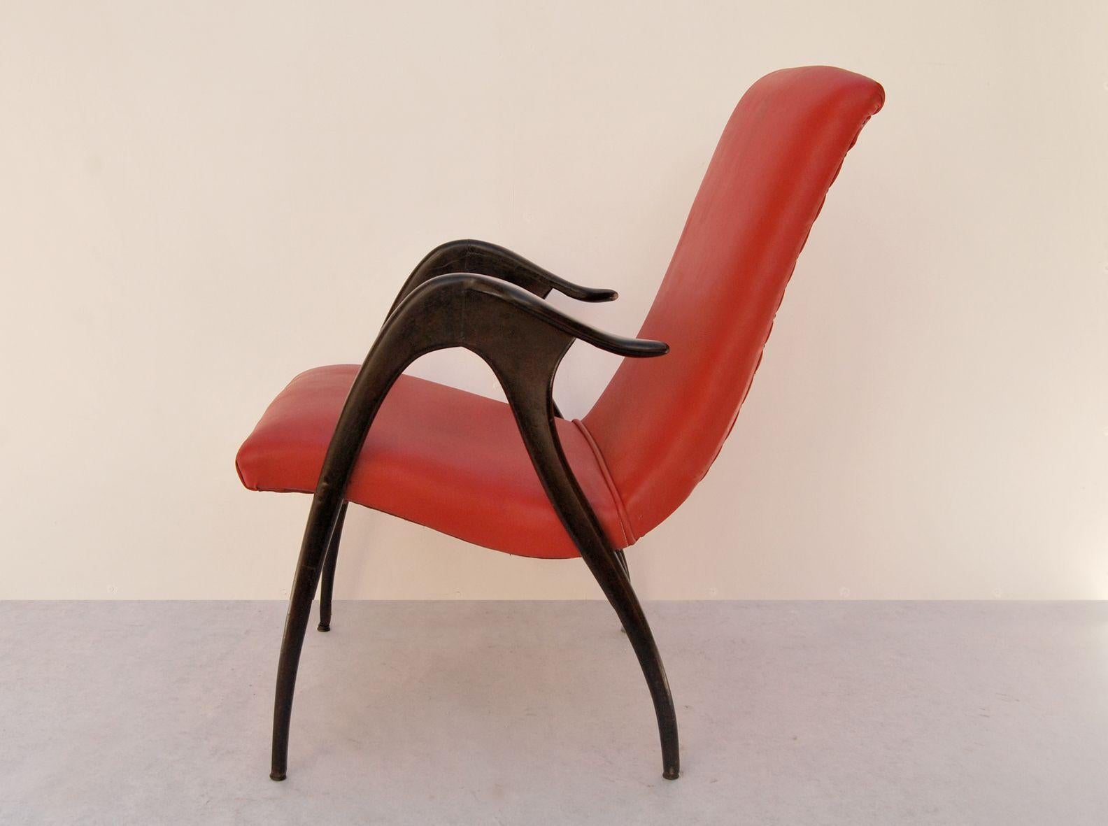 Malatesta and Mason armchair, 1950s, Made in Italy. 
Ebonized wood armchair with original patina of the period. The fabric of the armchair is red faux leather and is original. This seat was designed by Malatesta and Mason and produced in Italy in
