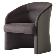 Fauteuil Pozzo : l'étreinte sinueuse du cuir en forme de coquillage