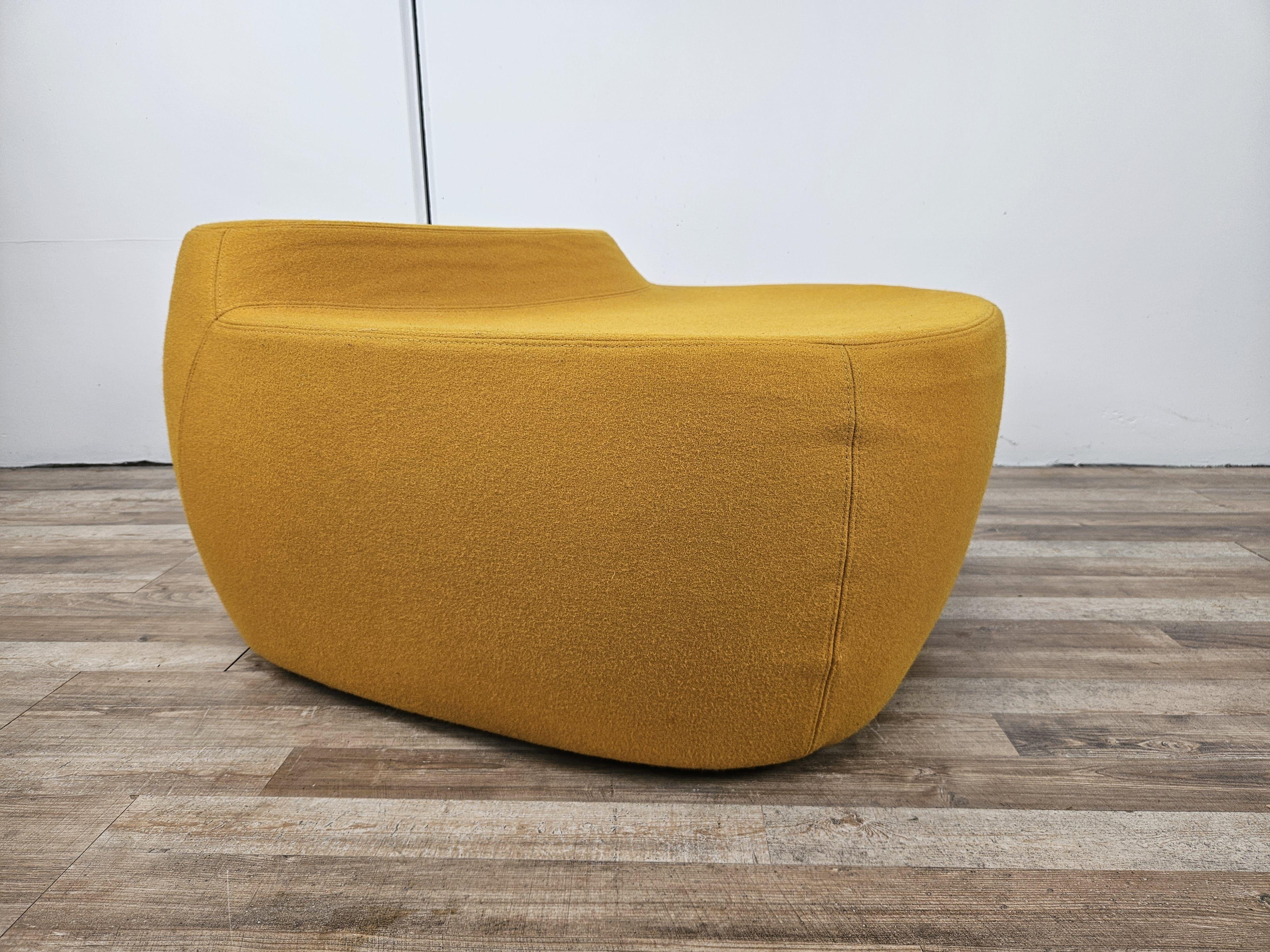 Design by Toshiyuki Kita from 1989, Moroso design late 1990s-first decade of 2000.

A combination of design and liveliness, this flame-retardant cold-foam armchair with steel inner frame and wooden base is ready to enrich any environment, from the