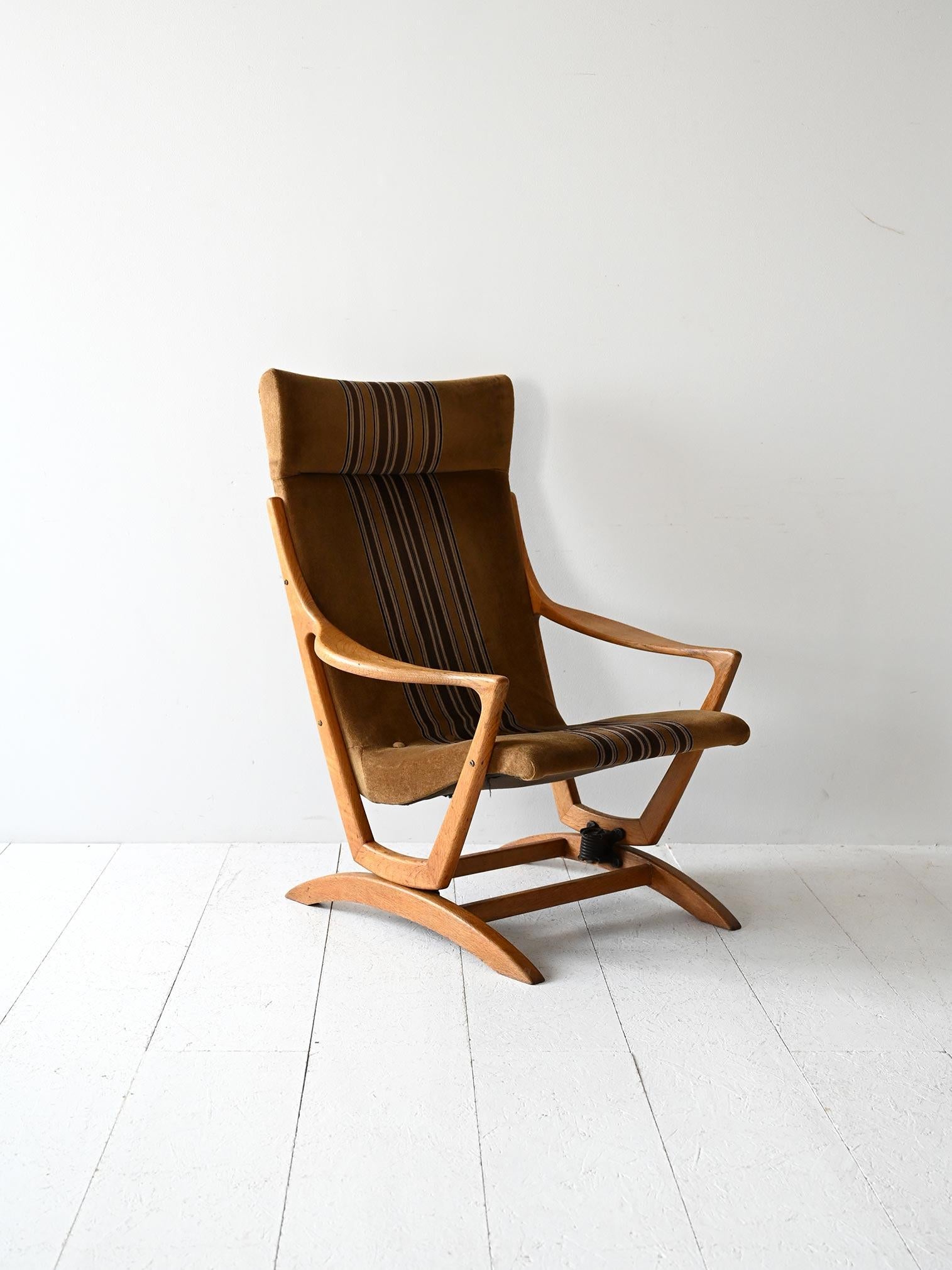 Vintage Scandinavian oak armchair with high back and original striped velvet upholstery, well preserved.

Original Scandinavian armchair from the late 1960s with an oak frame and slightly sloping high back. The upholstery is original, in army green