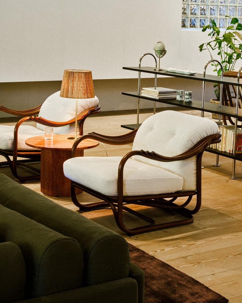 Poltrona Tria Lounge Chair in Rattan by Carlo de Carli for GUBI

Seamlessly merging the inherent beauty and charm of natural rattan with meticulous ergonomic precision, the Poltrona Tria Lounge Chair embodies both artistry and function. Constructed