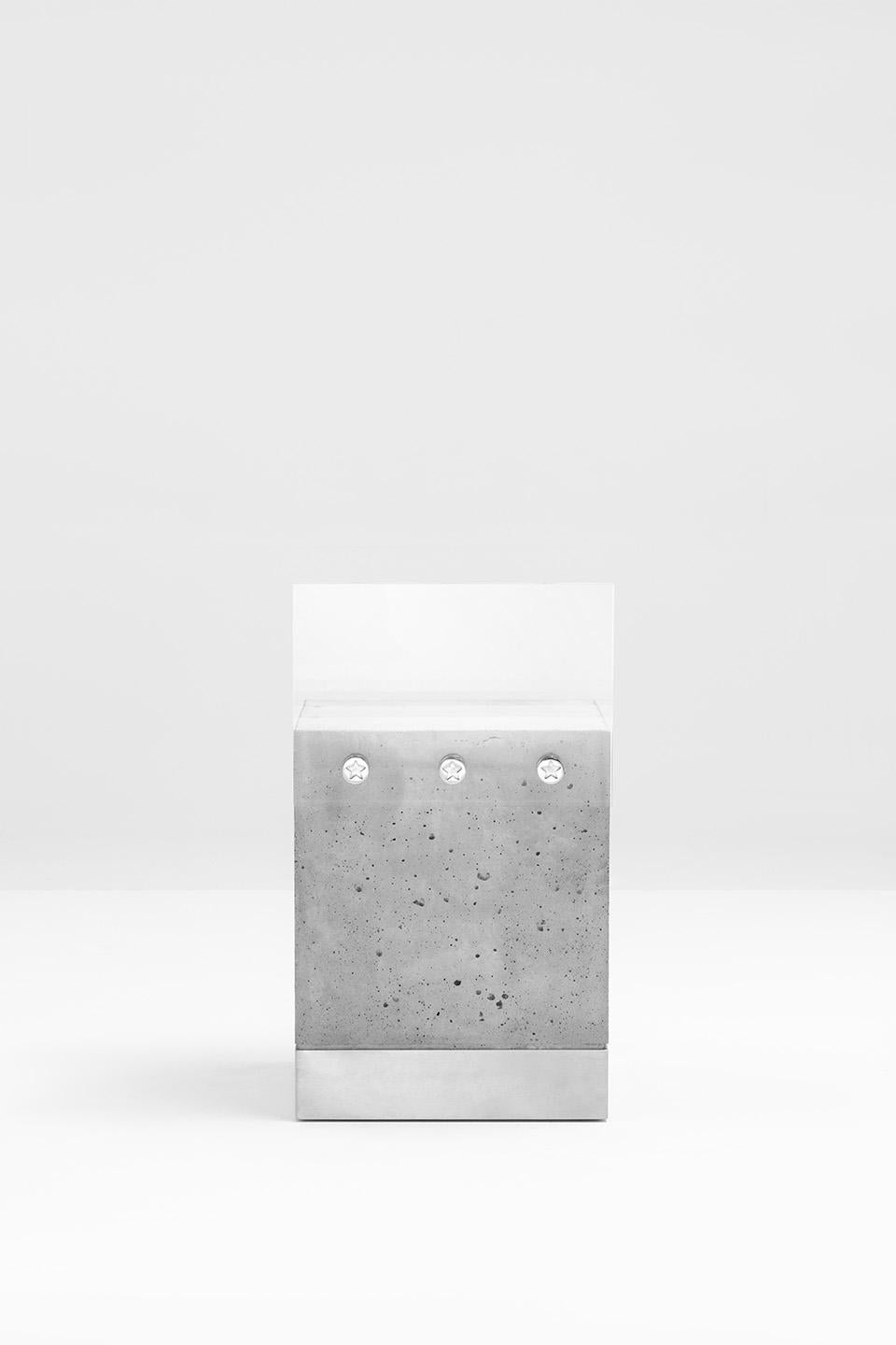 Chair with base in cement and brushed steel with backrest in plexiglass held by three chromed metal screws decorated with engraved stars and cushion upholstered in Tiger Silver fabric.
'Progetto Non Finito' collection from Dimoremilano, designed by