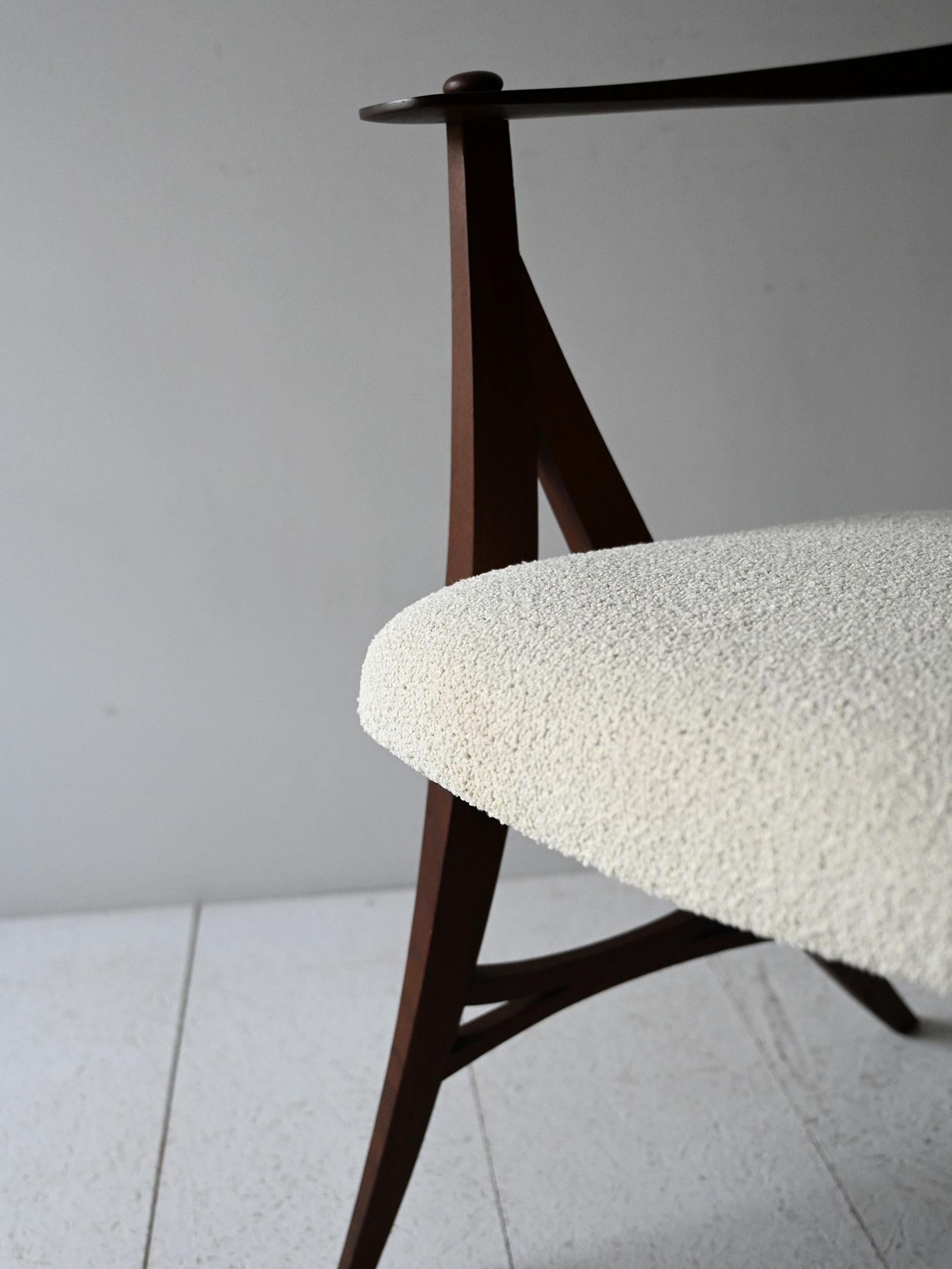Fabric 1950s vintage sculptural armchair with carved frame and new upholstery For Sale