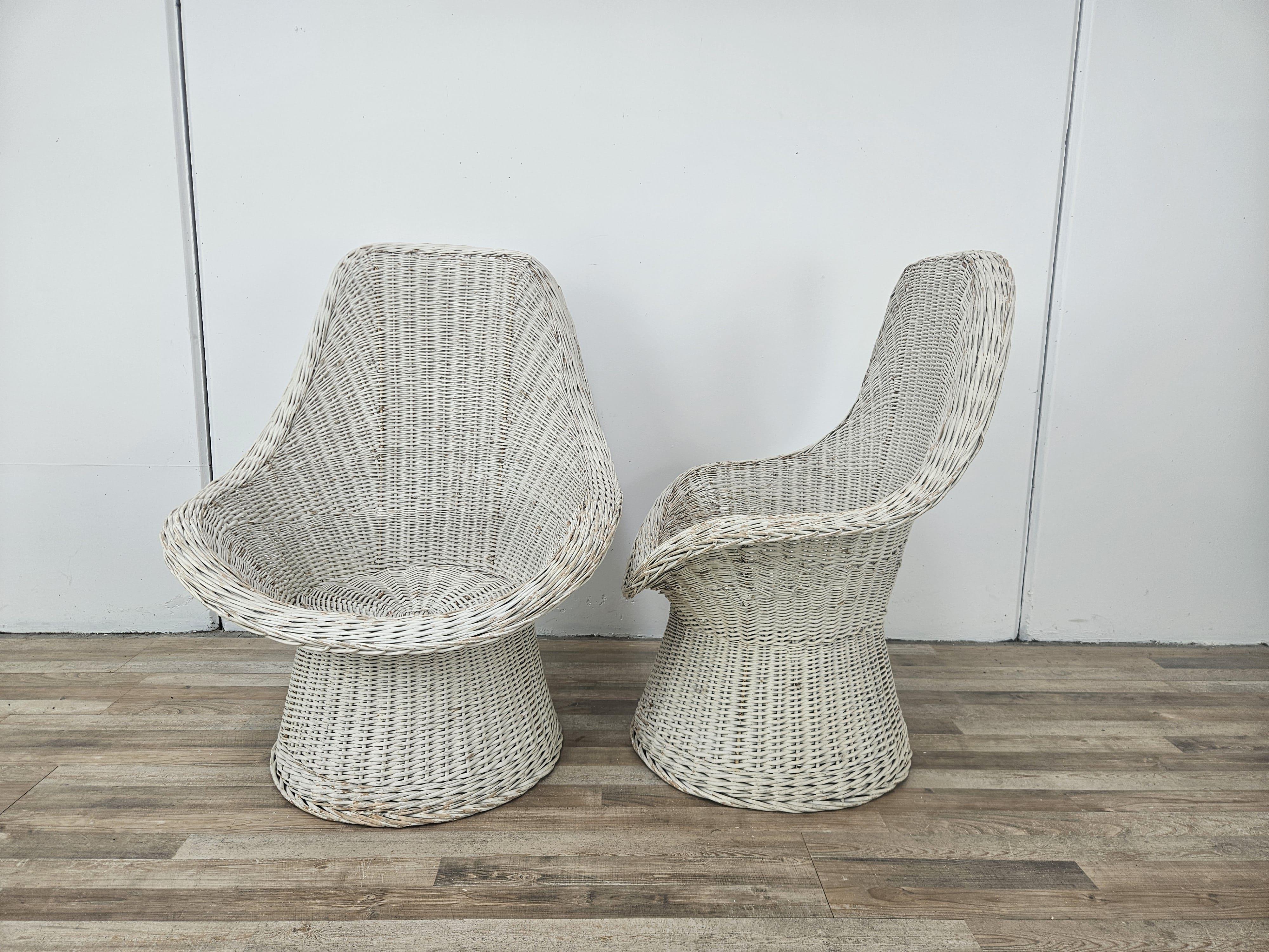 Pair of large white 1970s wicker armchairs, perfect for use in outdoor settings such as gardens and porches or in living rooms.

Normal signs due to age and use.
