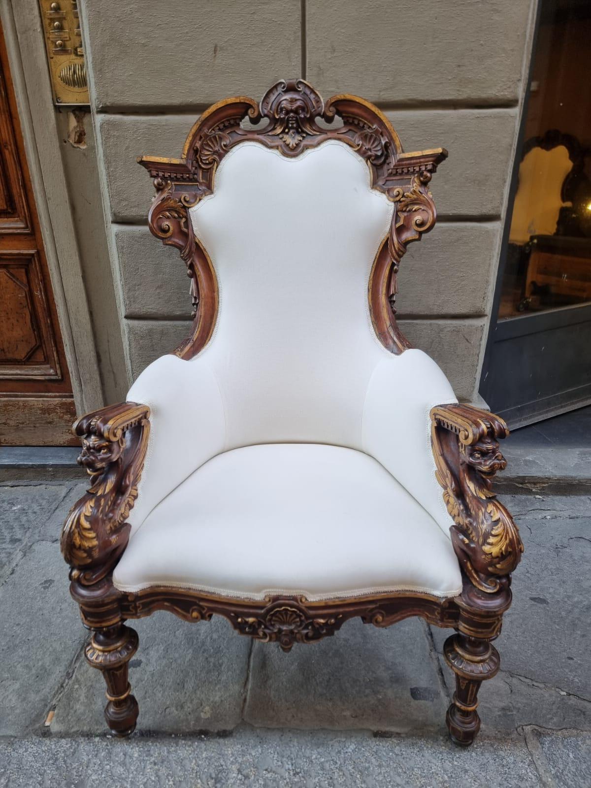 Exceptional pair of carved walnut armchairs with gilt parts.

The carvings on both armchairs are of extraordinary refinement, with finely worked details extending to all elements, including finely shaped armrests and legs, creating a visual harmony