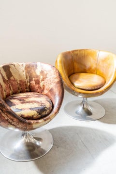 Leather swivel armchairs, early 21st century