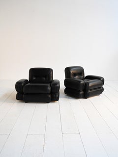 Black leather and tubular steel armchairs 1970s