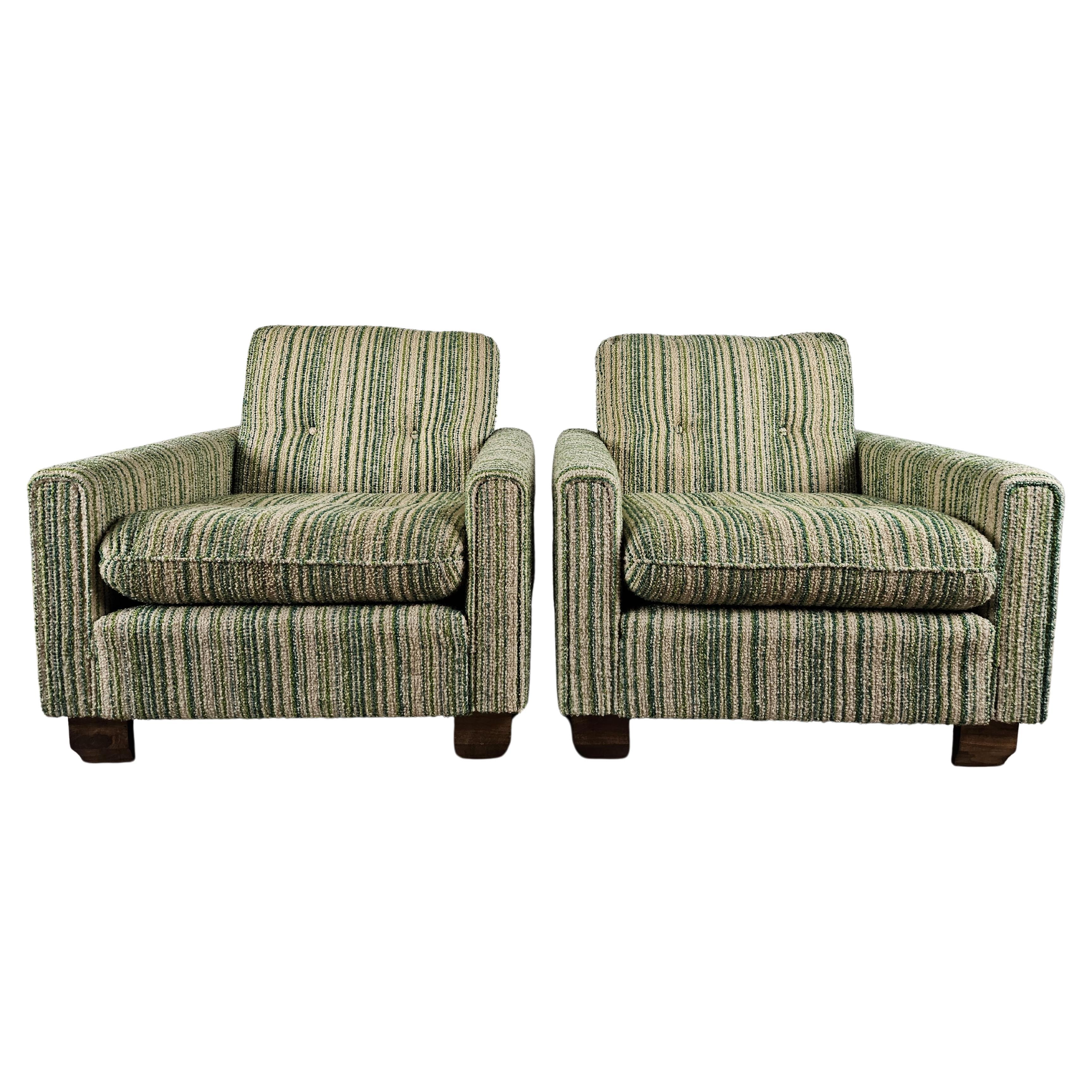 Green and white cloth armchairs with wooden feet