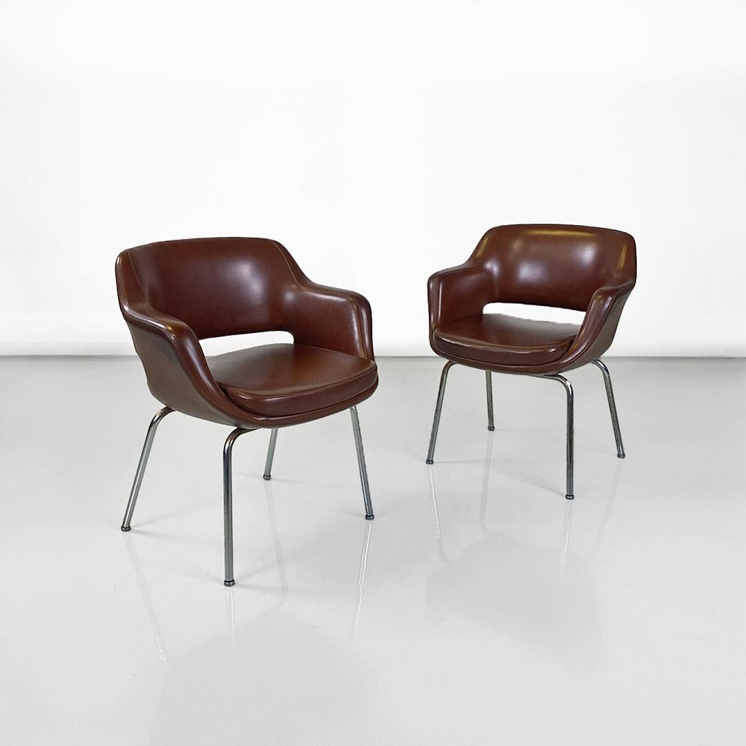 Italian and modern period armchairs in brown leather and chrome-plated steel, produced by Cassina ca. 1970.
Pair of brown leather office or desk armchairs with chrome-plated steel arms and legs. Simplicity and extreme comfort are the characteristics