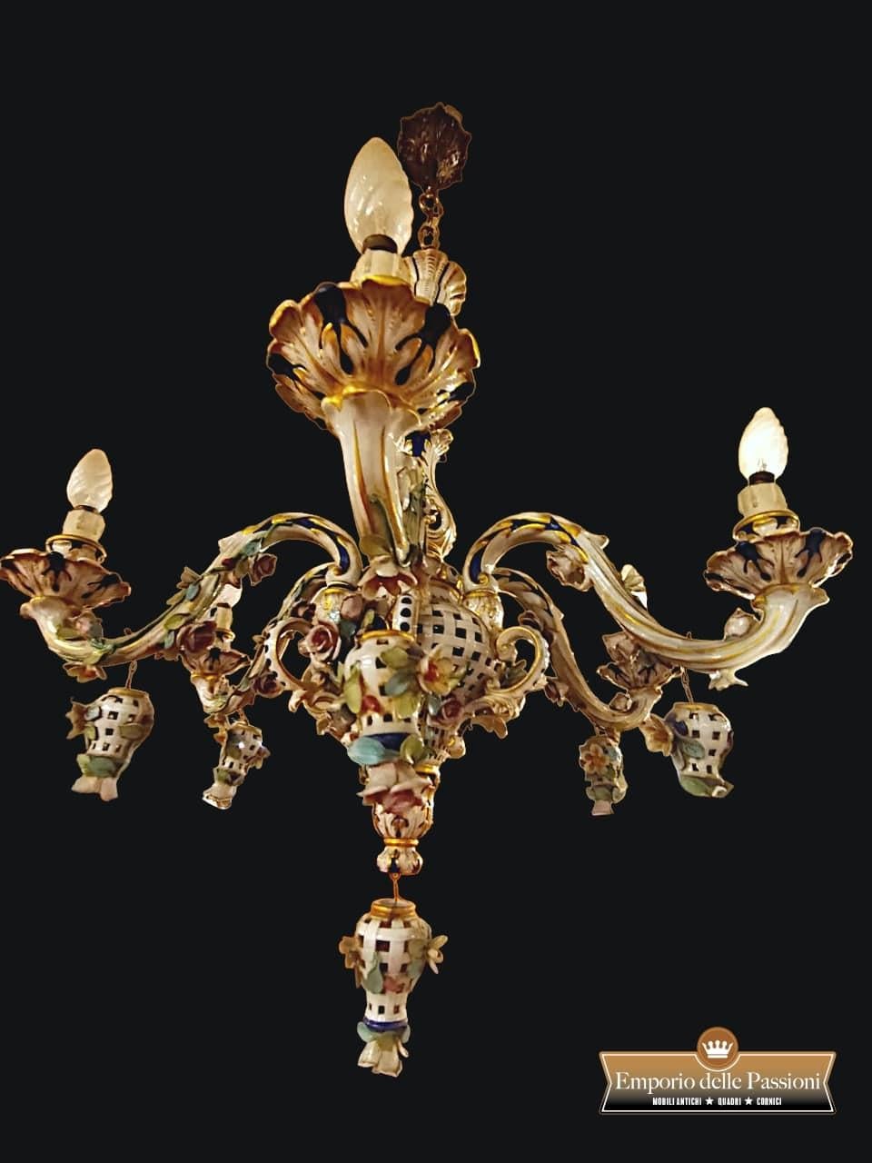 Capodimonte Porcelain Chandelier

Polychrome Capodimonte Porcelain Chandelier, from the 1950s.

Ceramic body decorated with colorful floral motifs and pendants in colored and gilded ceramic under the lights.

Large 6-arm chandelier, wonderfully