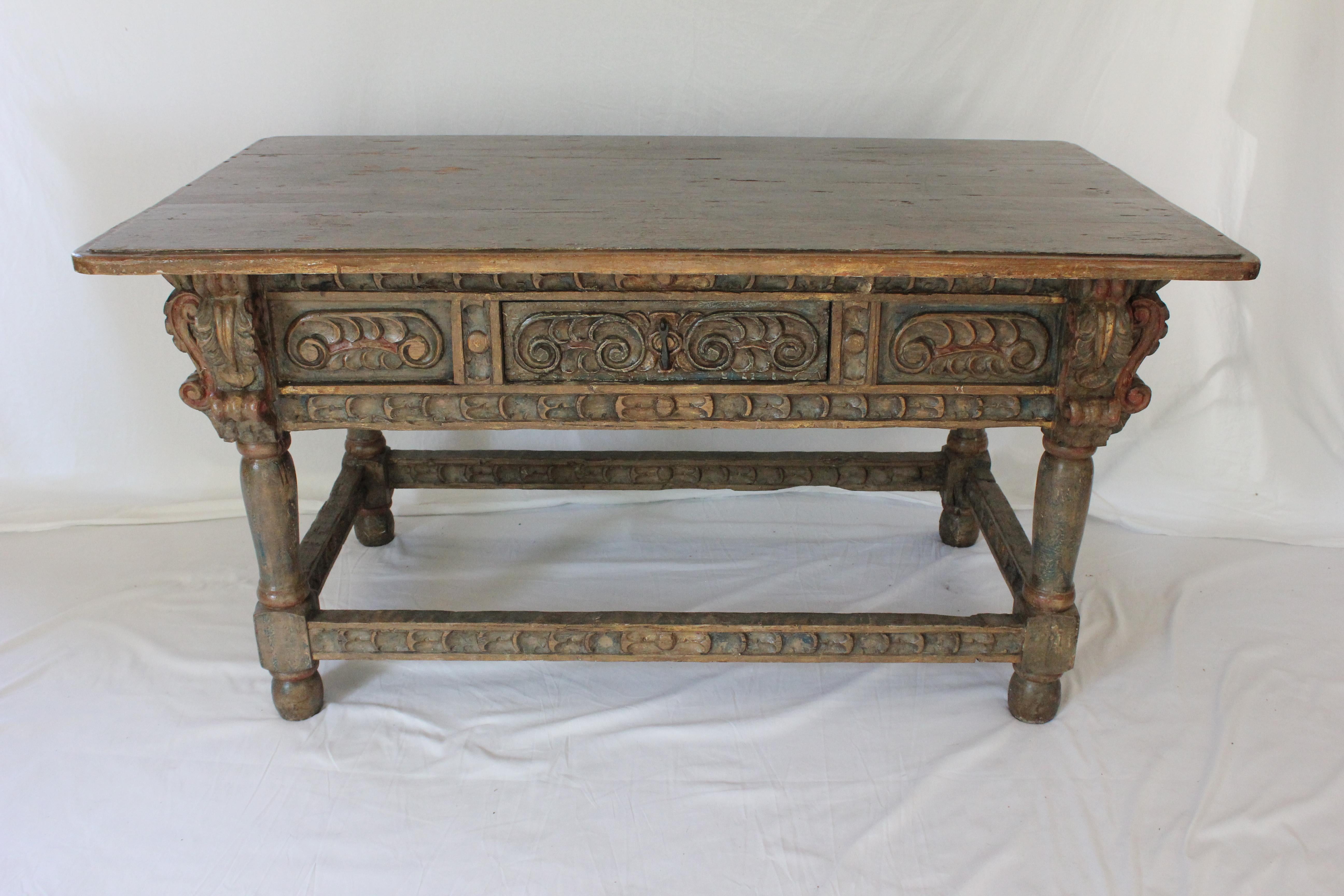Circa 1750 Spanish Baroque / Spanish Colonial Polychrome Heavily Carved Oak Refectory Table with 3 drawers (center drawer w/ lock) w/ highly carved drawer fronts, apron and bottom stretcher bars. Retains original polychrome finish.