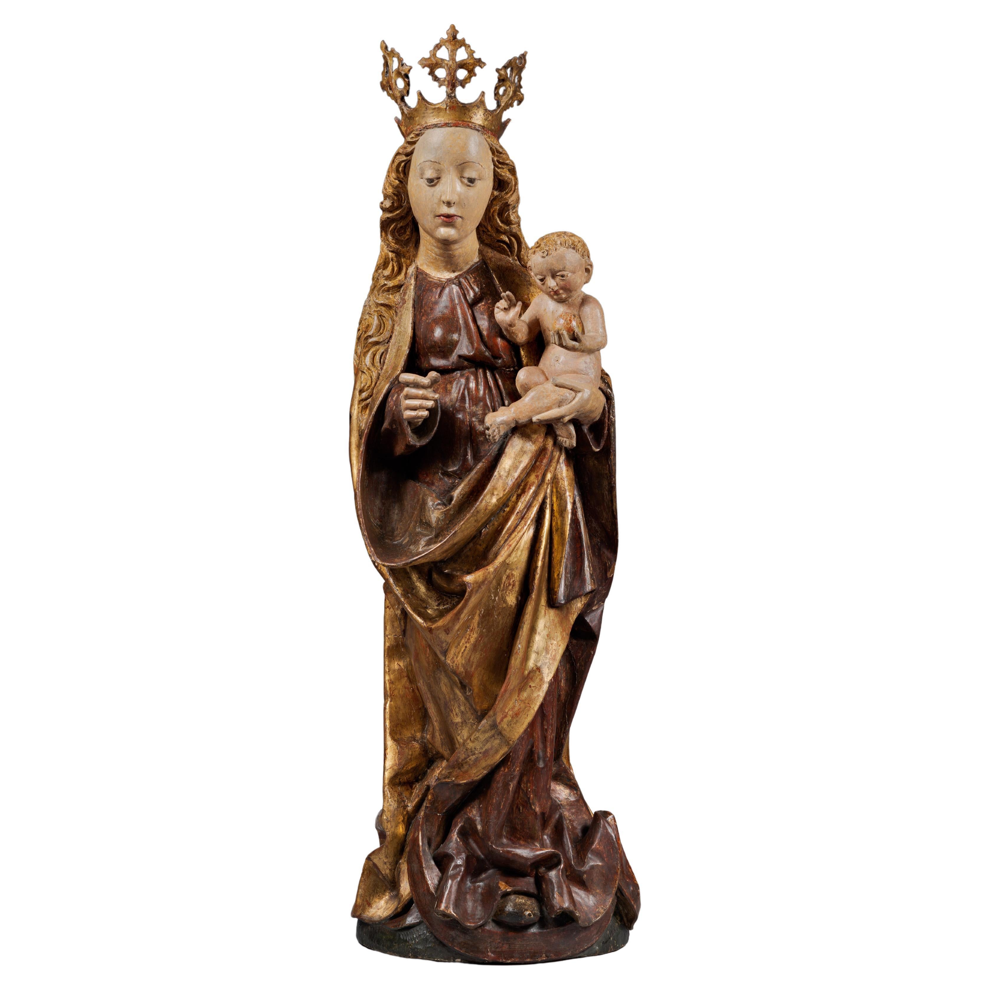 Vierge à l'Enfant en bois sculpté polychrome du XVe siècle en vente