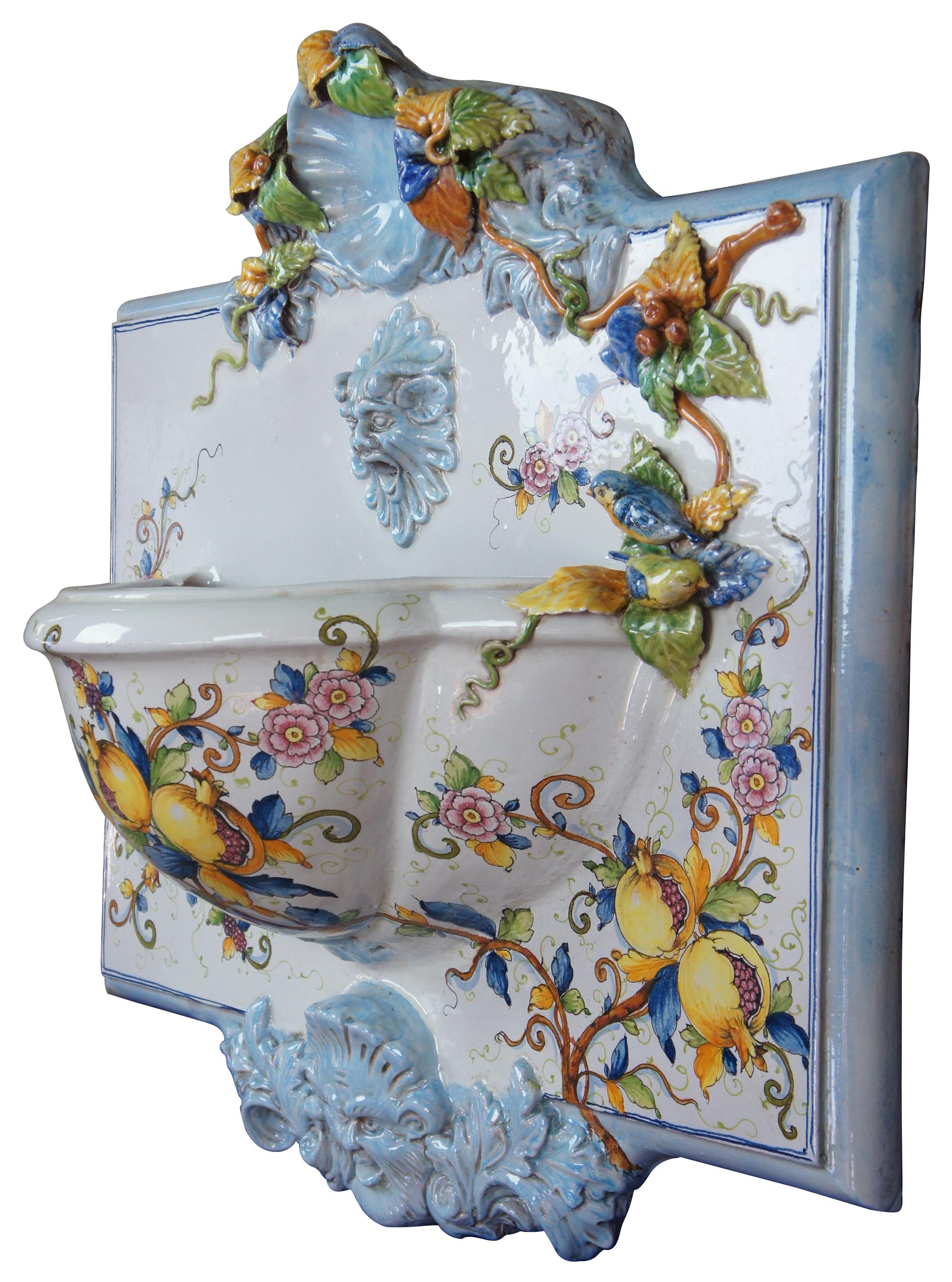 Polychrome ceramic Italian wall fountain figural Florentine Tuscan pottery

This beautiful handmade and hand painted Tuscan Italian wall fountain is graced with birds, pomogranits, flowers and figural spout. Scalloped shells can be seen on crown