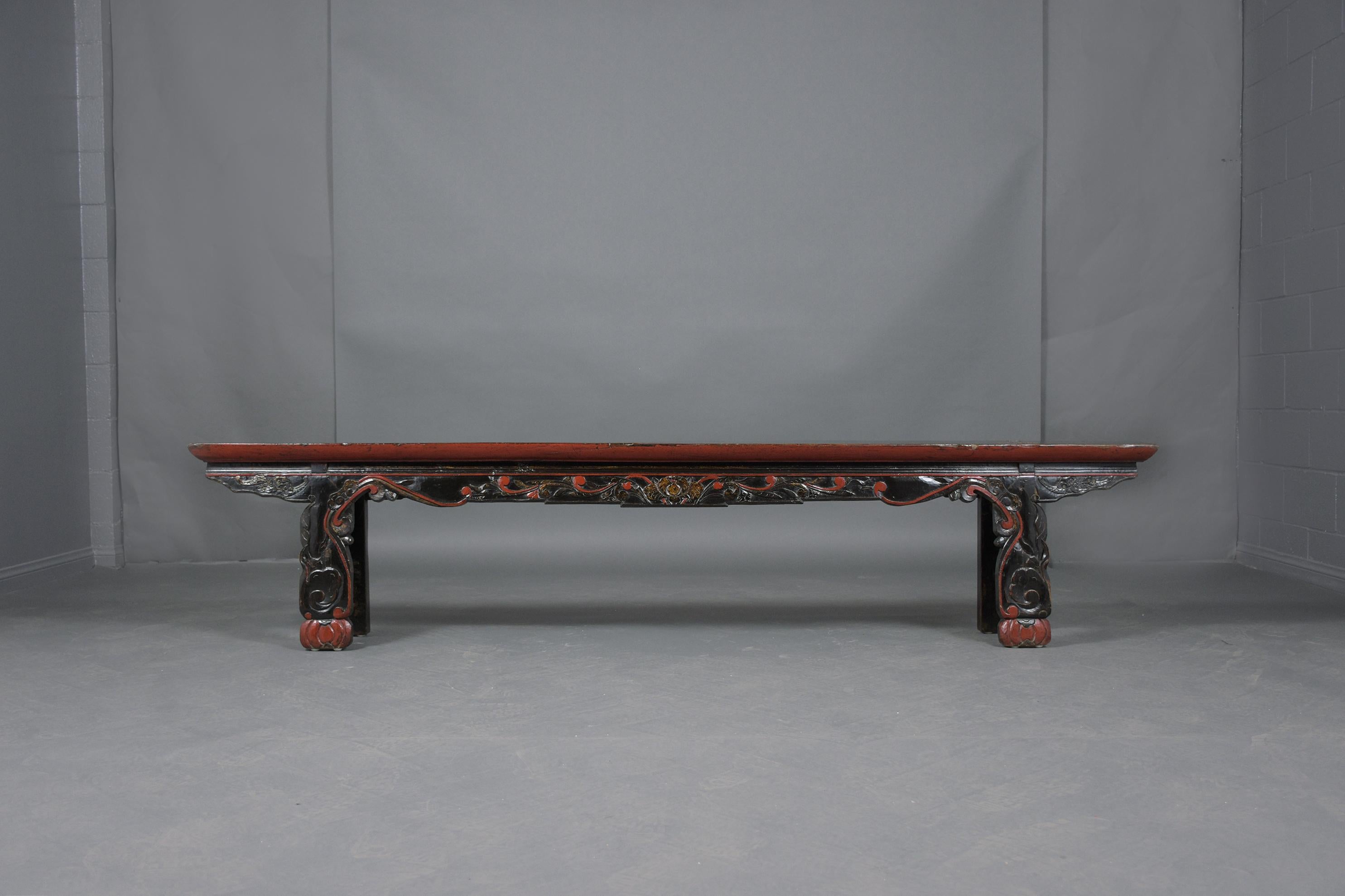 Discover the timeless elegance of our Vintage Chinese Ebonized-Red Teak Wood Bench, meticulously restored to its original glory by our expert craftsmen. Made from robust teak wood, this extraordinary bench stands out with its dual-tone ebonized and