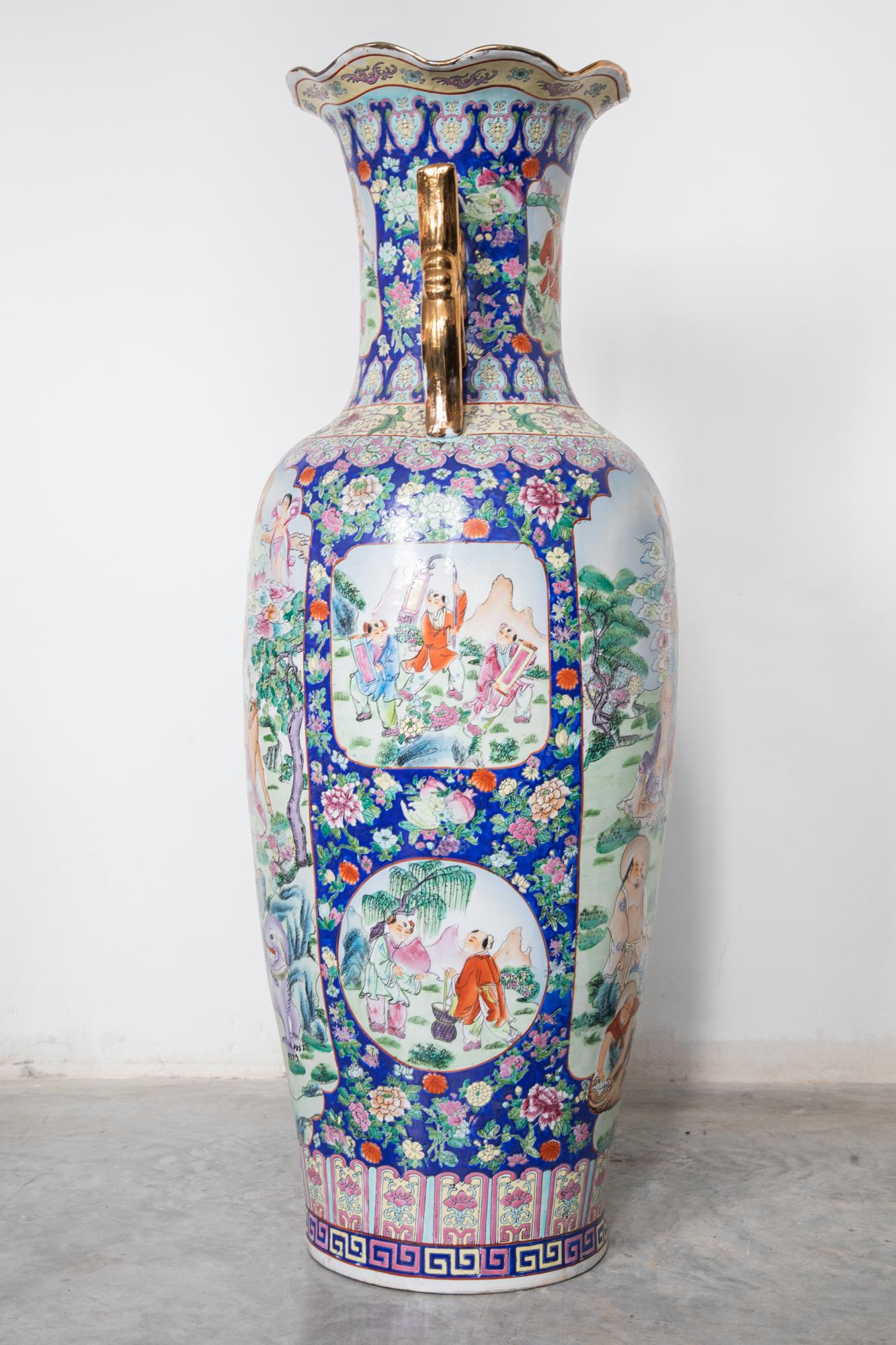 Large Cantonese baluster vase. Features decorated hand-painted polychrome Family Rose palette with cartouche panels of figures in a hunting scene motif with exotic animals. Made in China for the European Market. Dimensions Height 50 inch.Canton