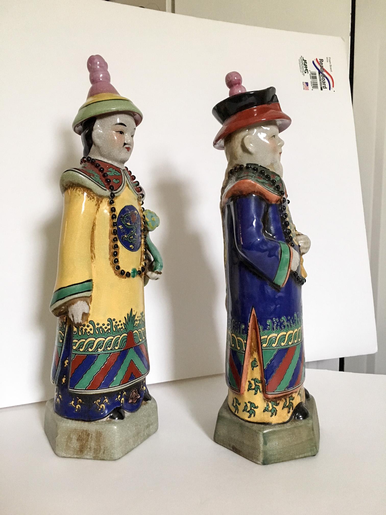 Large-scale pair of ceramic polychrome Chinese emperor statues beautifully detailed and hand painted. Measures: Left figure, 14.75