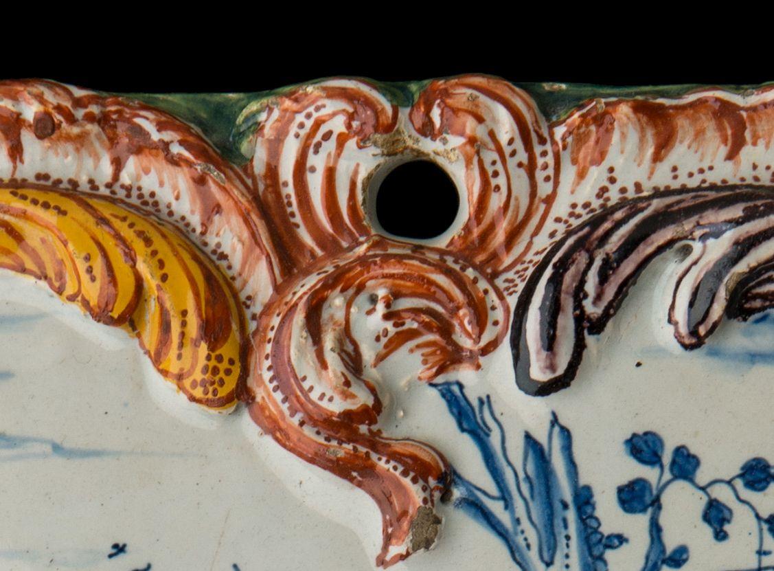 Baroque Polychrome Delft Plaque with a courteous scene Delft, circa 1760 For Sale