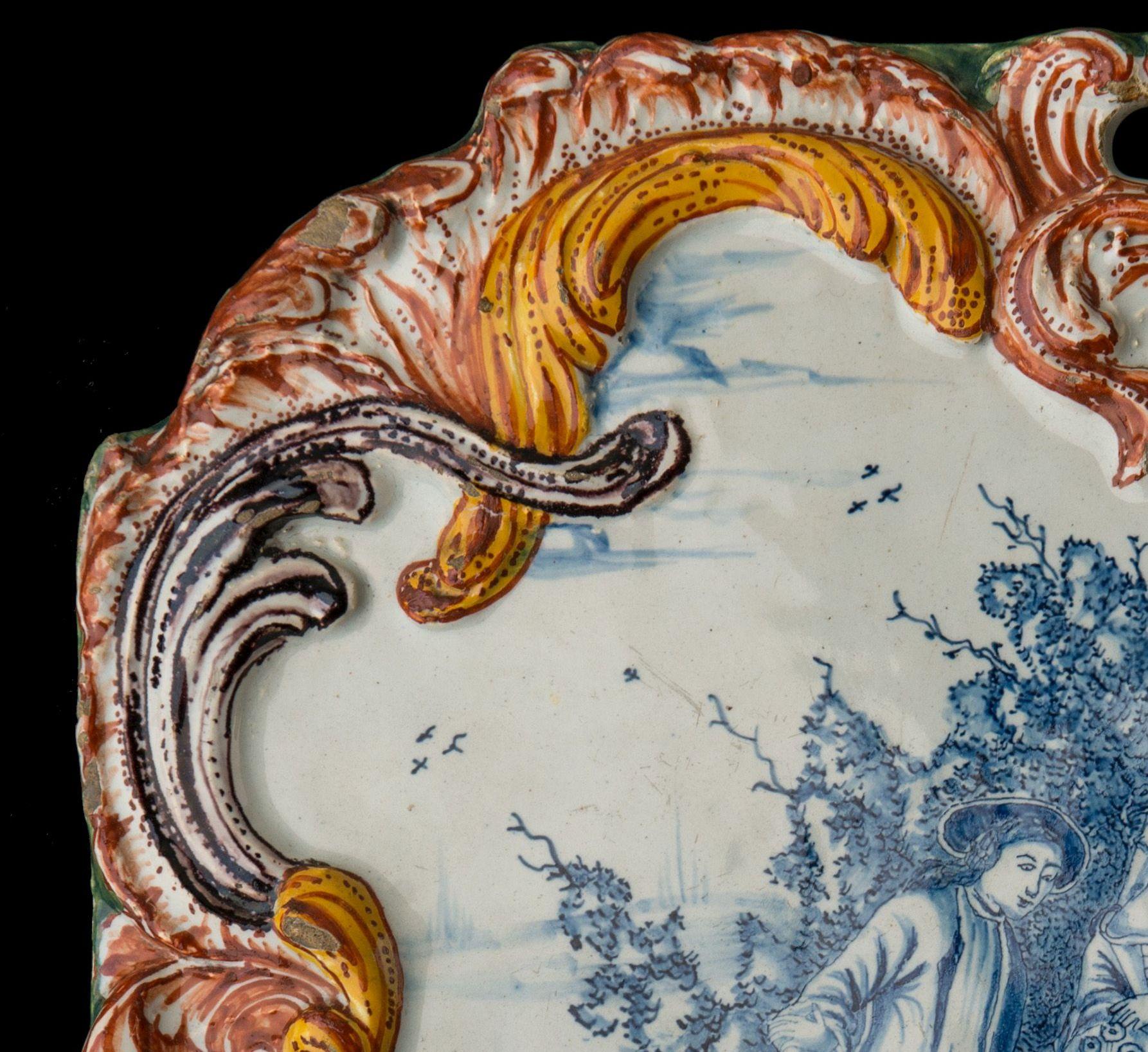 Dutch Polychrome Delft Plaque with a courteous scene Delft, circa 1760 For Sale