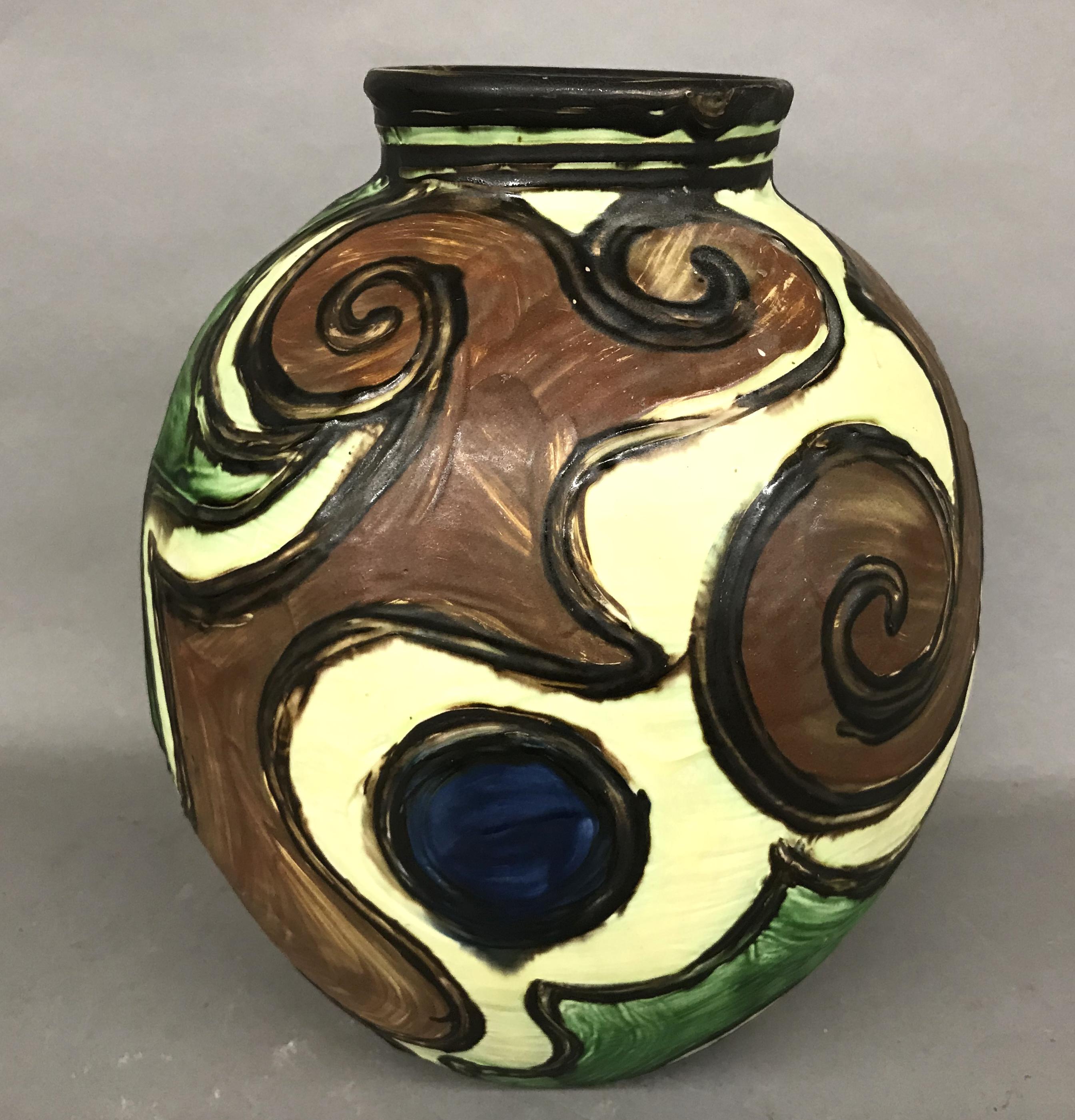 A fine polychrome earthenware vase by Danish artist Jens Thirslund (1892-1942) made for Herman. Kähler Keramik. Thirslund, a known Danish painter, married Stella Kähler, daughter of Herman August Kähler, and became the artistic leader of the Kähler